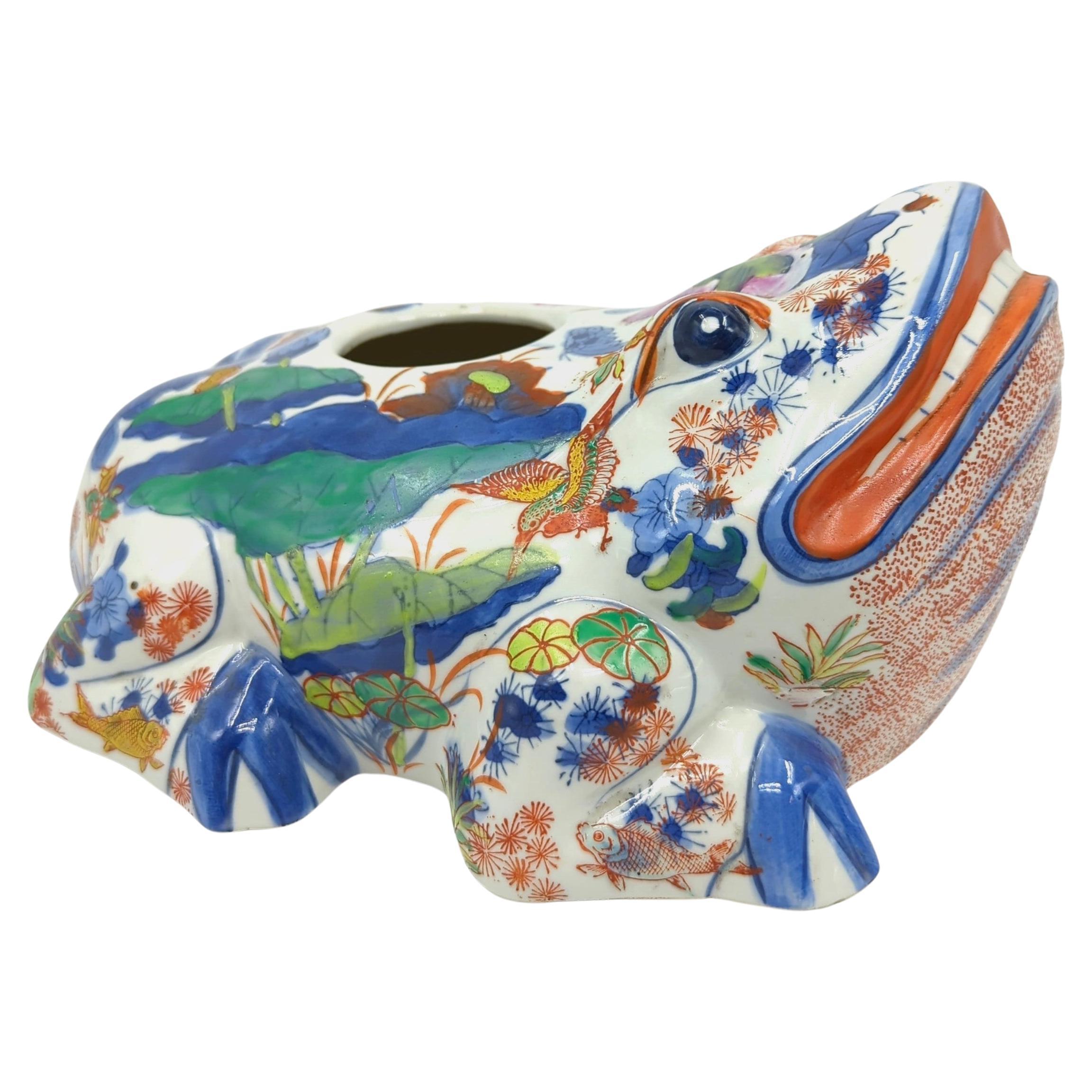 We are pleased to present this large, polychrome doucai-decorated frog vase, a remarkable piece from the late Qing dynasty. The vase is colourfully adorned in overglaze famille rose and underglaze blue on white ground, techniques that exemplifies