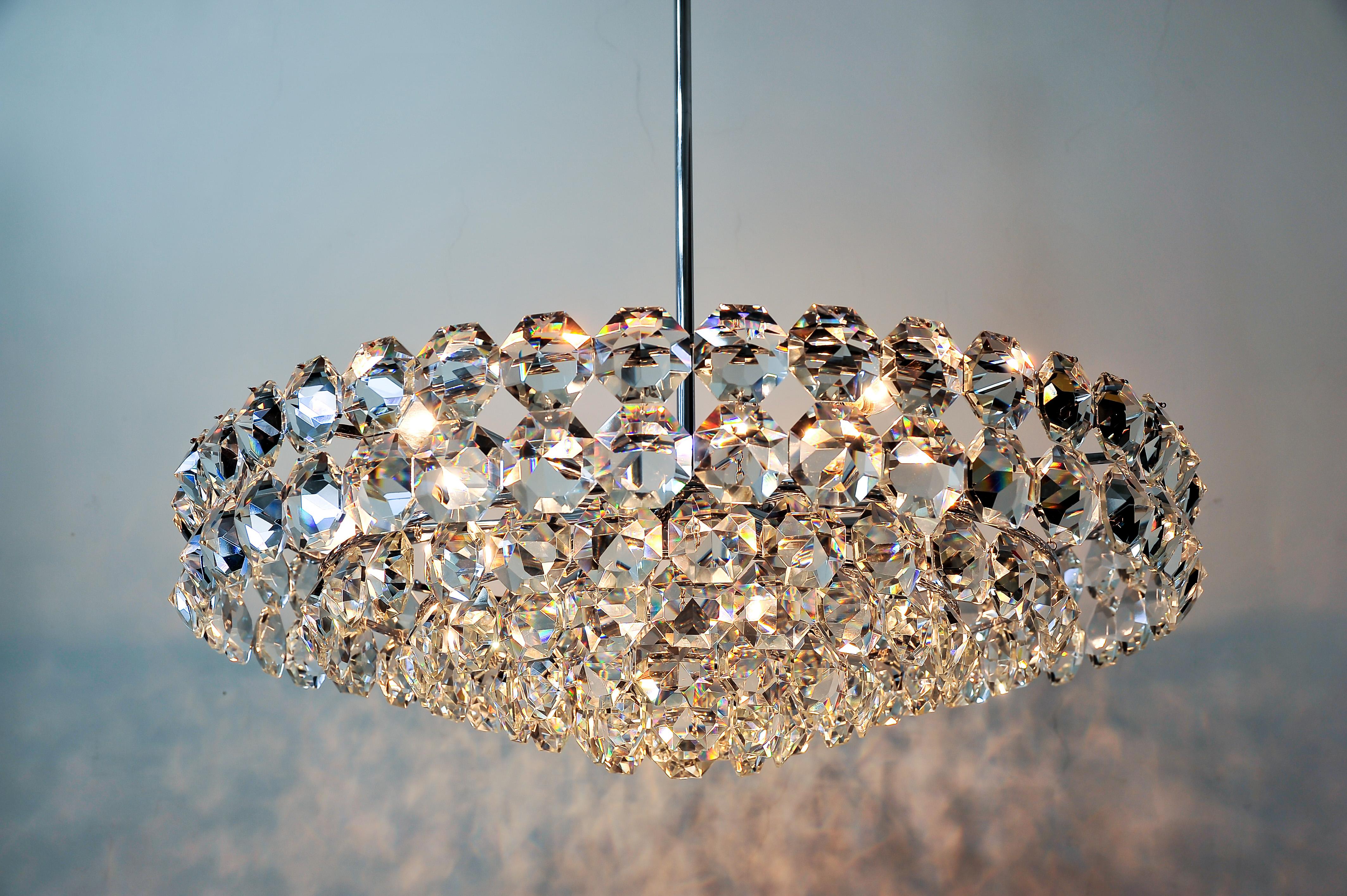 Huge chromed chandelier, circa 1960s.
Very good original condition.
Not one glass part is broken, they are in excellent condition.
18 bulbs
We can change the high of the chandelier to fits for different rooms.
The crystal glass parts are 60 x