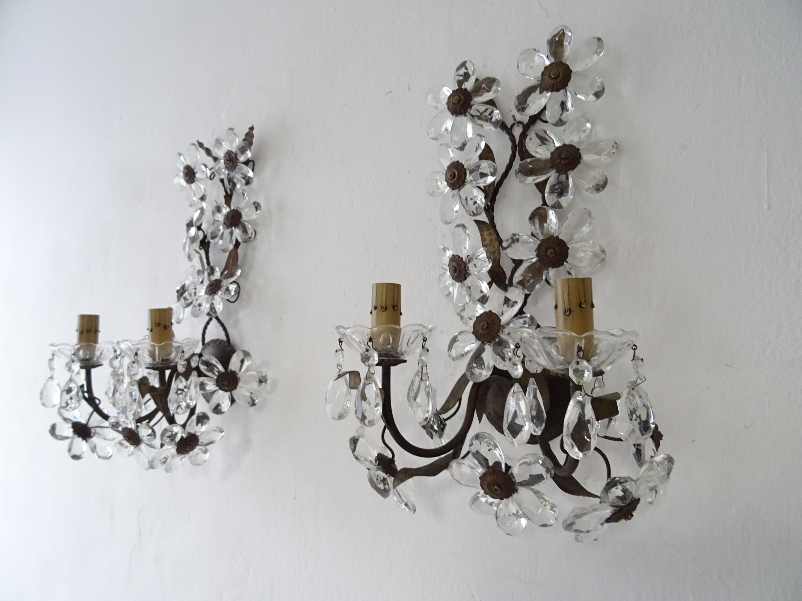 Housing two lights each, sitting in crystal bobeches dripping with crystal prisms. Will be rewired with certified UL US sockets for the USA and appropriate sockets for all other countries and ready to hang. Brass leaves with perfect patina. Adorning