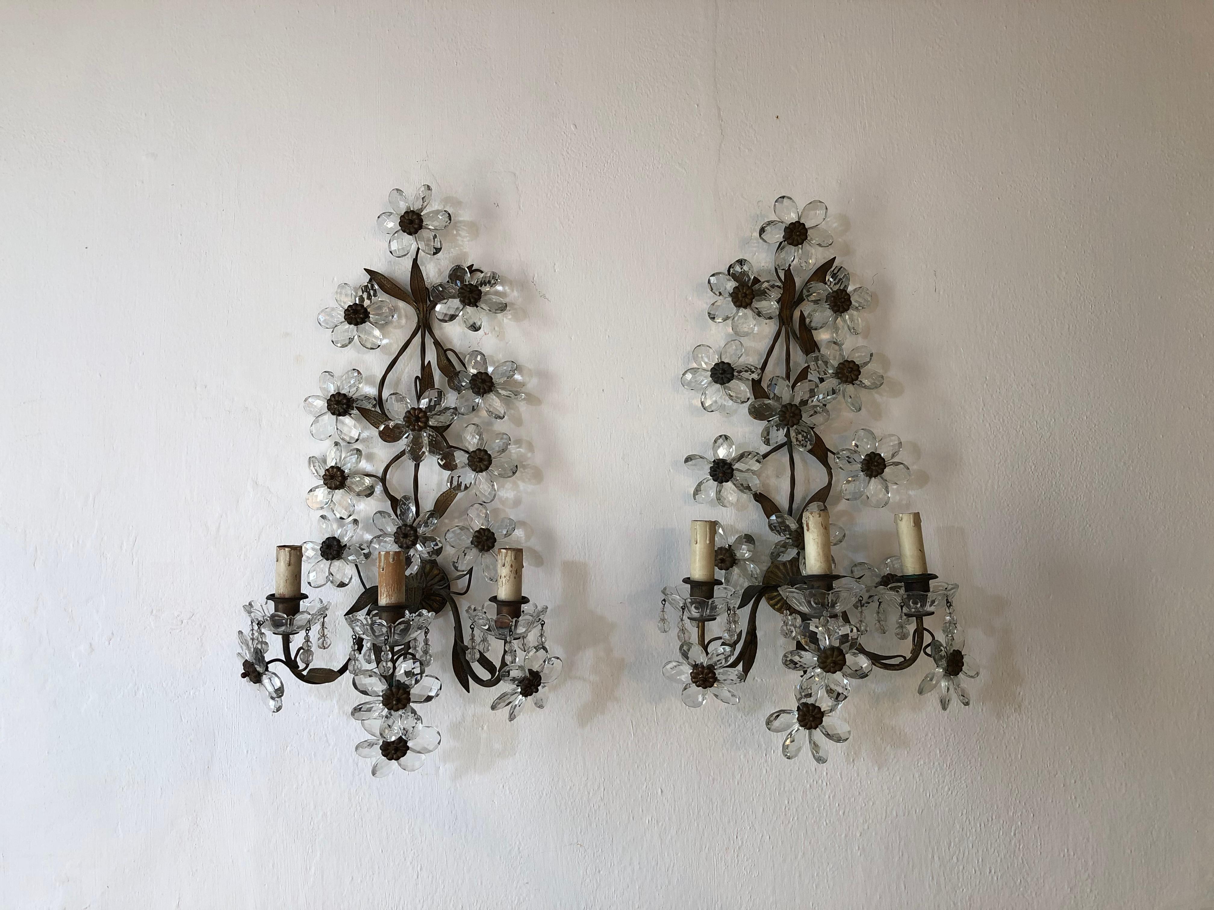 Housing three-light each, sitting in crystal bobeches dripping with crystal beads. Rewired and ready to hang. Brass leaves with perfect patina. Adorning clear prism flowers. Free priority shipping from Italy.