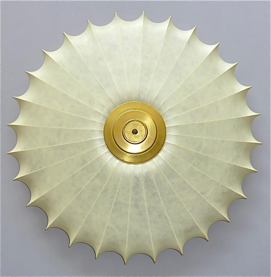 Huge sculptural cocoon flush mount chandelier or ceiling lamp, Italy around 1950s. Creamy beige to ivory color cocoon resin fabric which is perfect for soft and beautiful light effects over a sunburst starburst wire construction and patinated brass