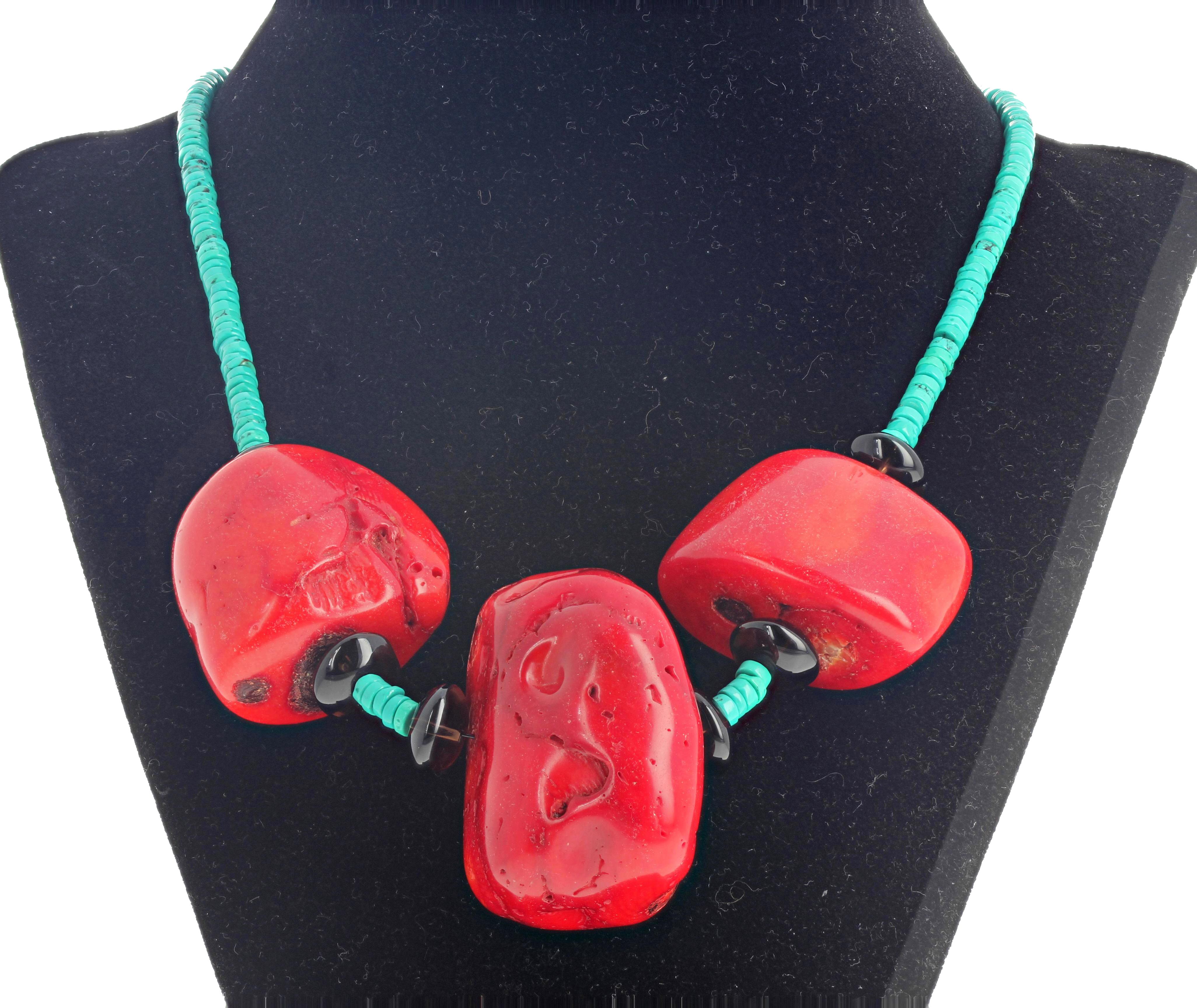 Artistic Bamboo Coral and Turquoise 20 inch long MAKE A STATEMENT necklace with gold plated hook easy to use clasp. The largest Coral is 45 mm x 25 mm.  This goes happily from daytime to evening occasions.  If you wish faster delivery on your