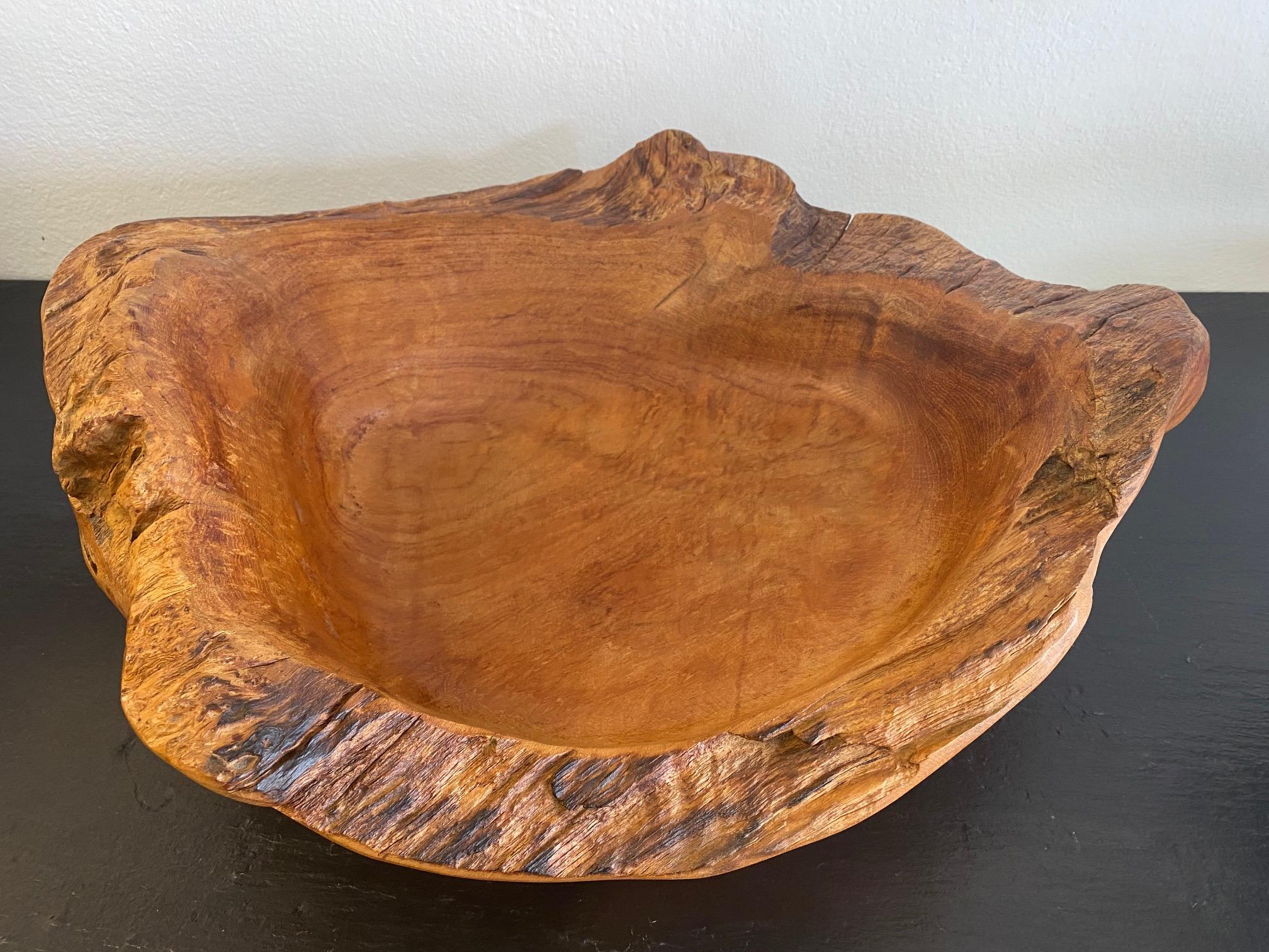 Large hand craved wood bowl with natural edges
See photo with soda can to get a sense of scale.