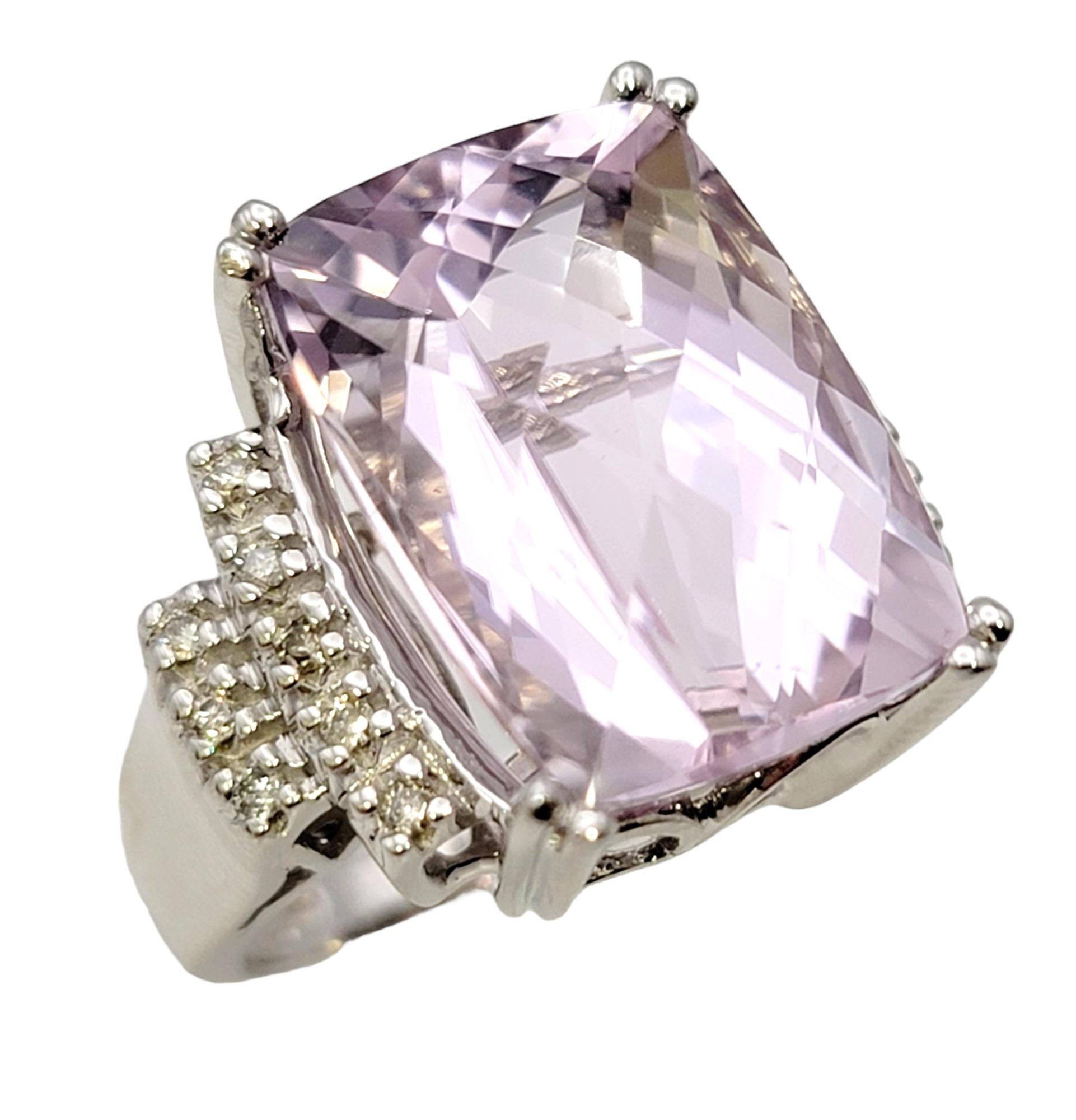 Ring size: 6.75

This dreamy ring is truly breathtaking! The massive kunzite and diamond cocktail ring will fill your finger from end to end with sensational sparkle. It is an absolutely stunning, eye-catching piece that makes a bold statement with