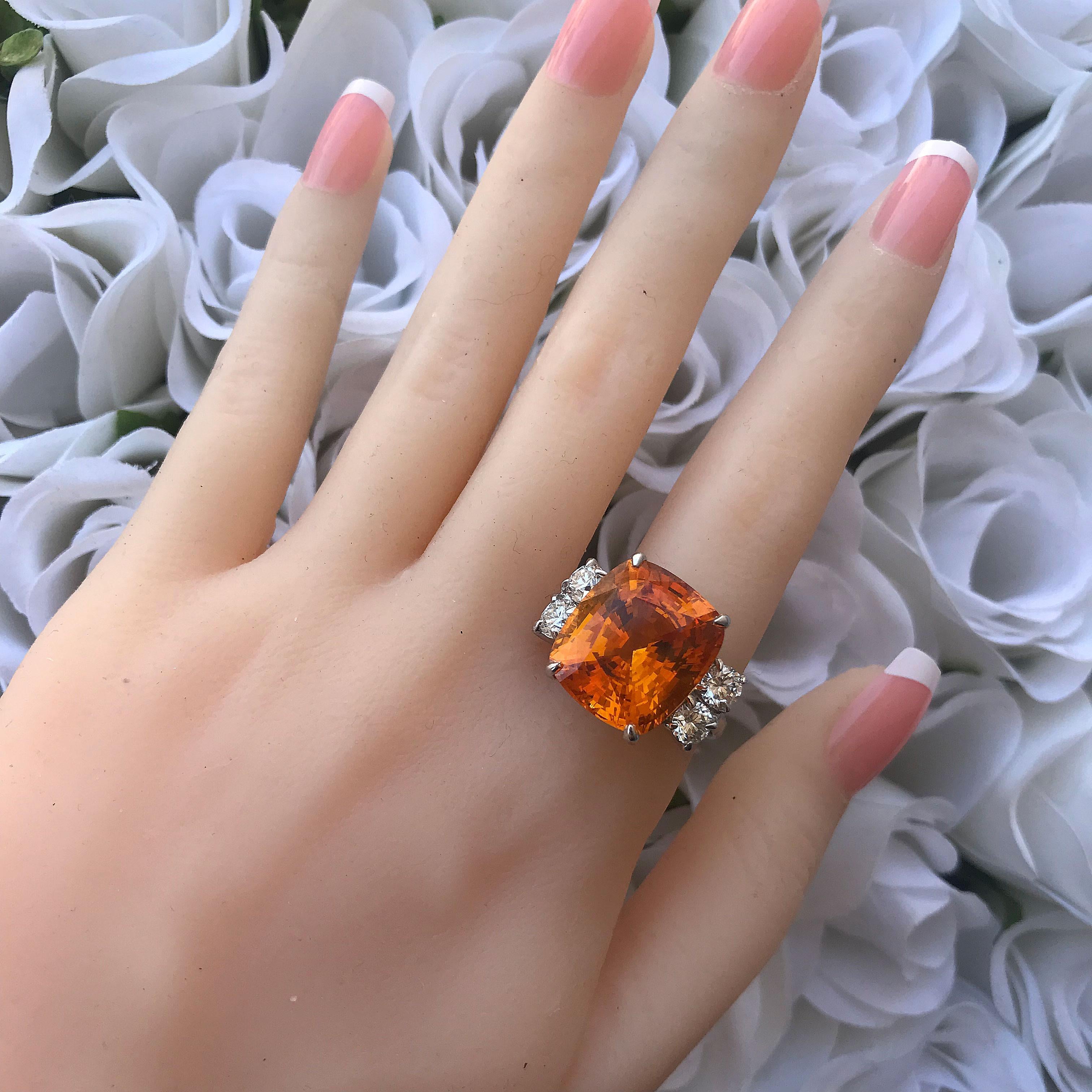 Selling a Almost 20 Carat Huge Cushion Natural Honey Orange Sapphire & Diamond Ring AGTA Certified.

1. Carat Weight: Apprx 20 Carat Sapphire

2. Color: Honey Orange 

3. Tone:  Medium - Nice, 7.0 Out of 10

4. Hue: Vivid Medium Orange.

3. Clarity: