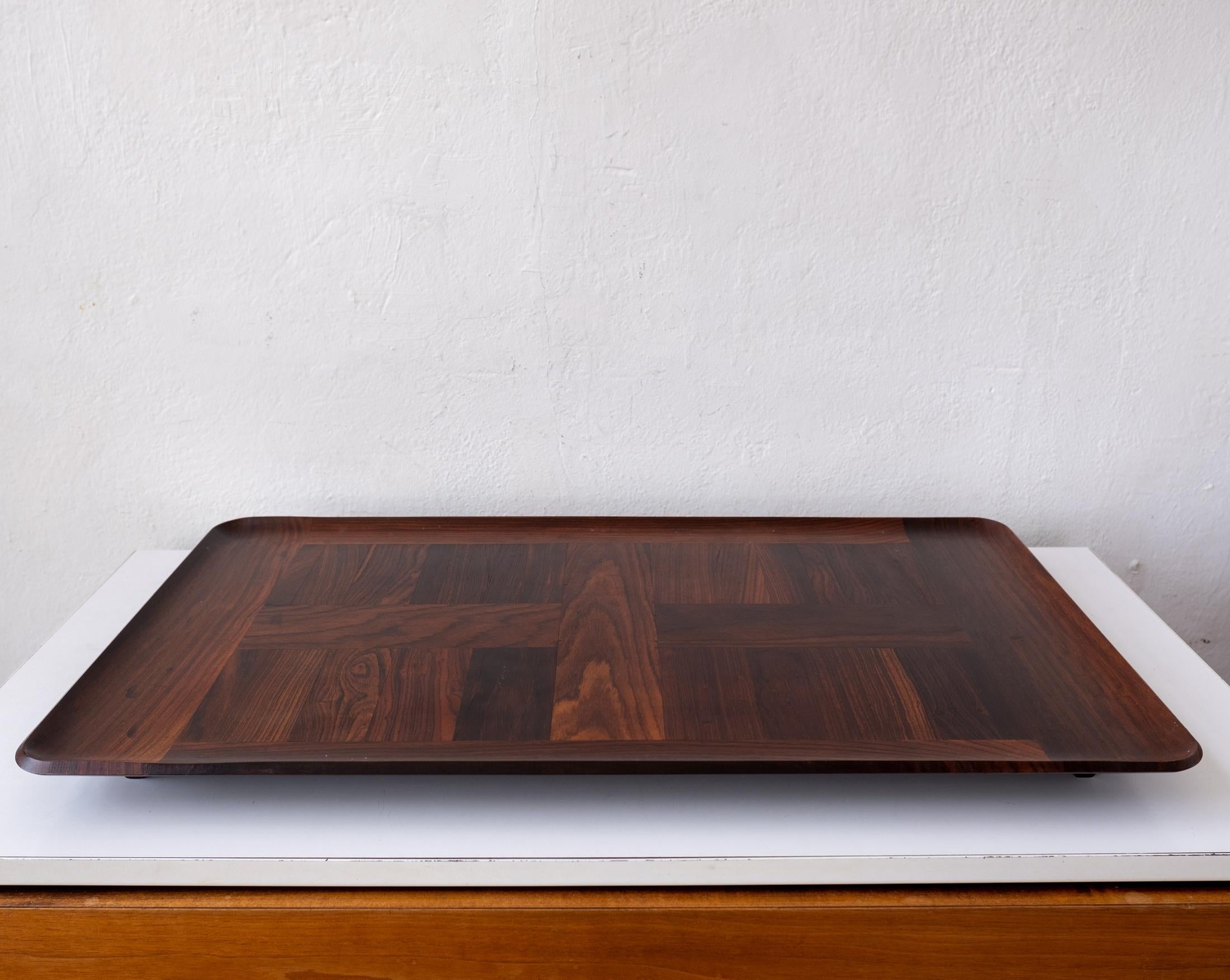 Huge tray designed by Jens Quistgaard for the Dansk Rare Woods Collection. Constructed of Cocobolo. Introduced in 1961, the Rare Woods line represented the finest designs and materials Dansk had to offer. 

Dansk described them:
Good design grows