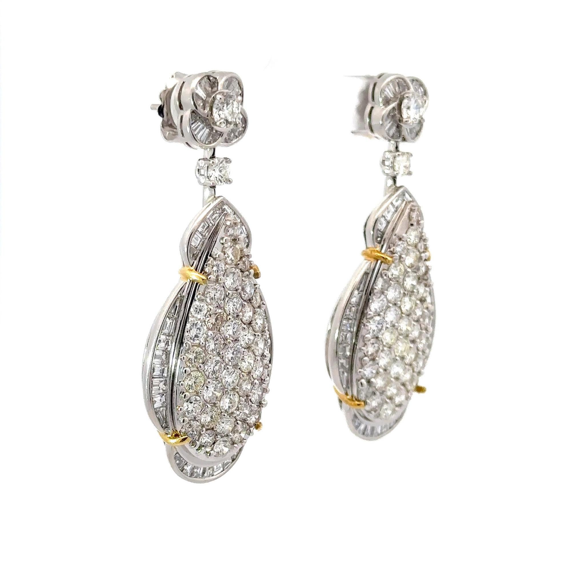 This magnificent pair of 18K White gold and Diamond drop earrings with 18K Yellow gold accents is more than a picturesque luxury piece, behold this true vision of excellence and craftsmanship. The perfect pair of Diamond Pear shape Drop earrings