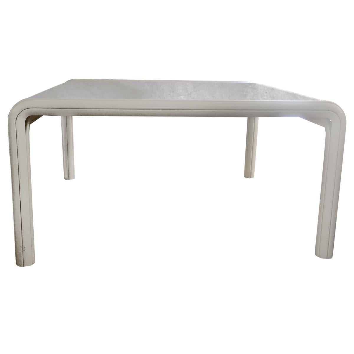 Monumental and very heavy square dining table Orsay designed by Gae Aulenti for Knoll International.
This table has an off-white lacquered aluminium frame and a white/grey marble top.
It can seat up to 8 persons with its royal dimensions of 145 x