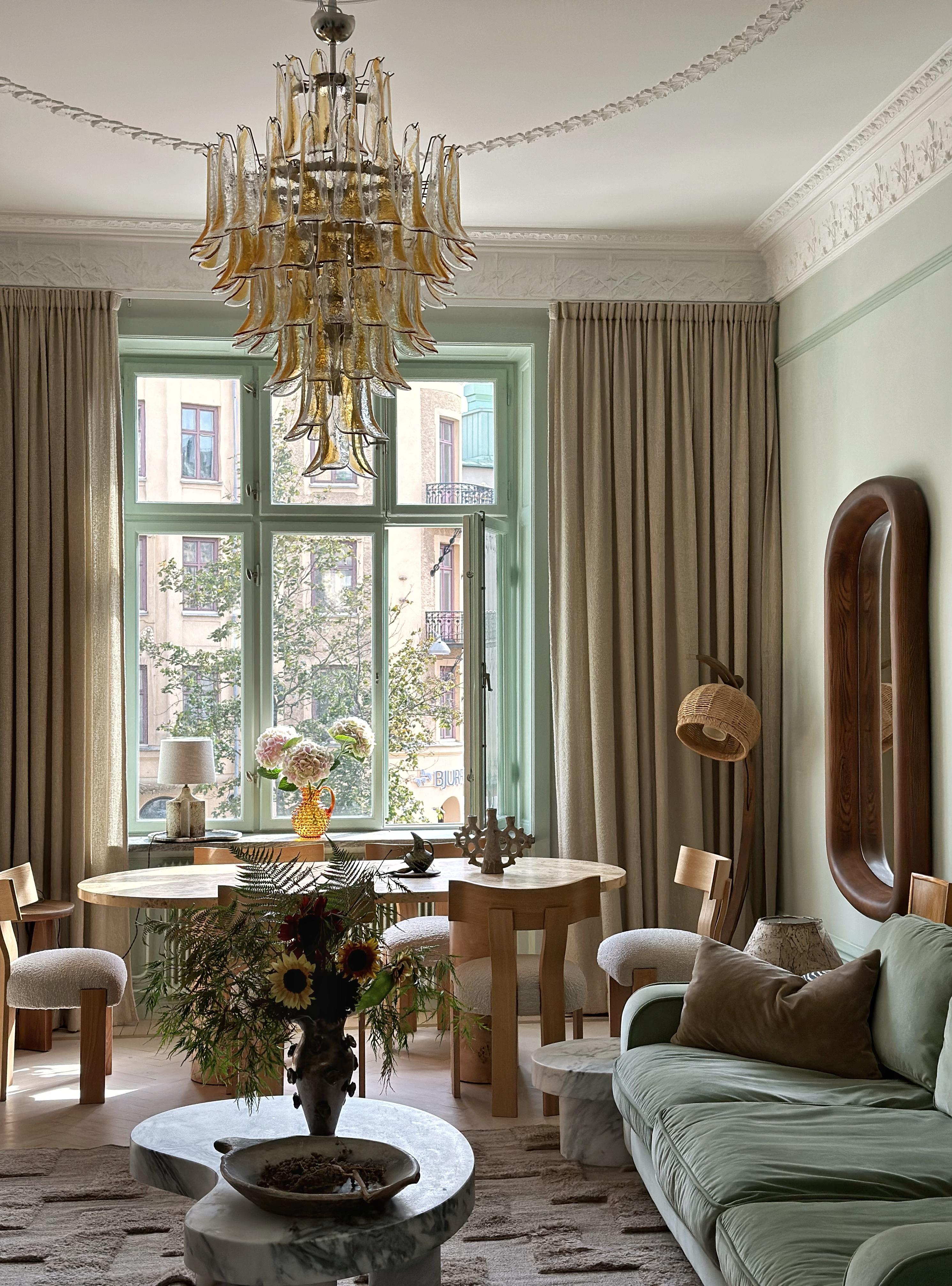 Huge Murano Glass Chandelier with Glass Prisms in a cool 70's vibe in honey / amber tones.  Contemporary Chandelier in Traditional Italian Mid-Century Style.
The chandelier is composed of 95 Handmade Prisms in the size of 29 x8 cm (11.4