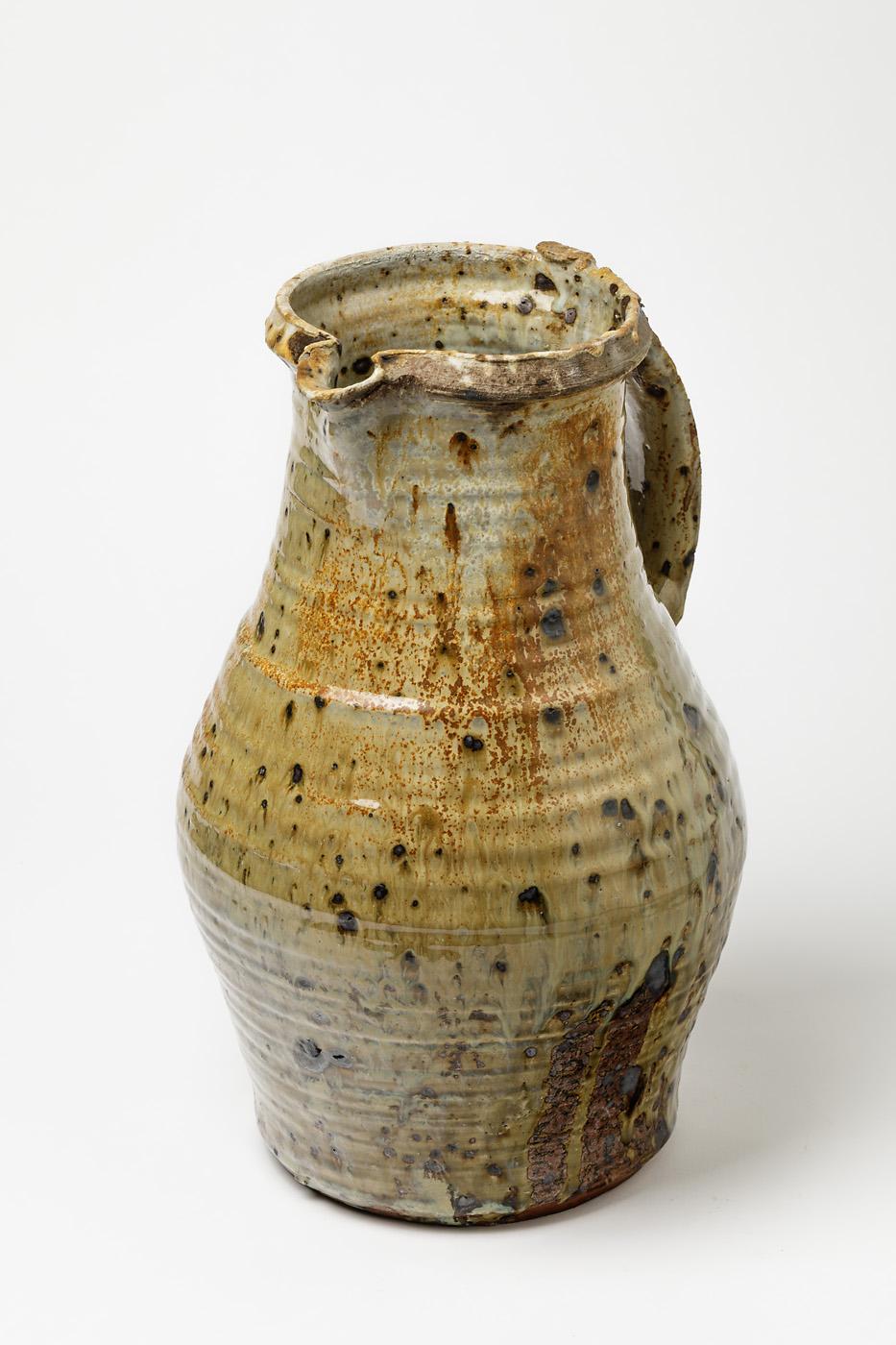 Anne Kjaersgaard (1933-2009)

Huge and amazing stoneware pottery pitcher by the Danish artist.

Amazing firing color really shinny.

Rare and collectible ceramic piece.

Dimensions: 35 x 25 x 22 cm.