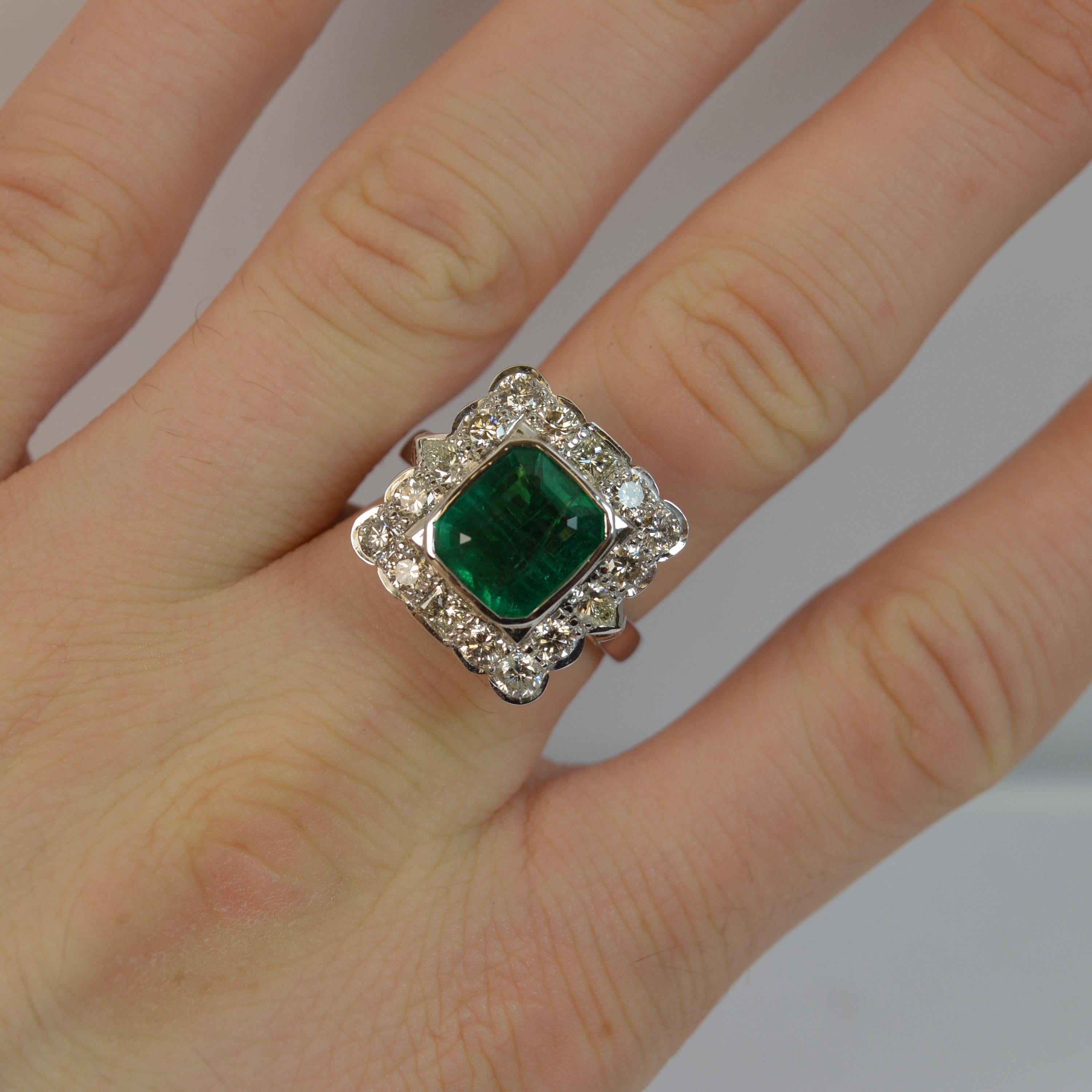 
An absolutely stunning Emerald and Diamond cluster or cocktail ring.

Set with a large cushion emerald cut natural emerald in a collet mount to the centre, 8.7mm x 9.7mm approx. A very vibrant and vivid emerald.

Surrounding the emerald are 12