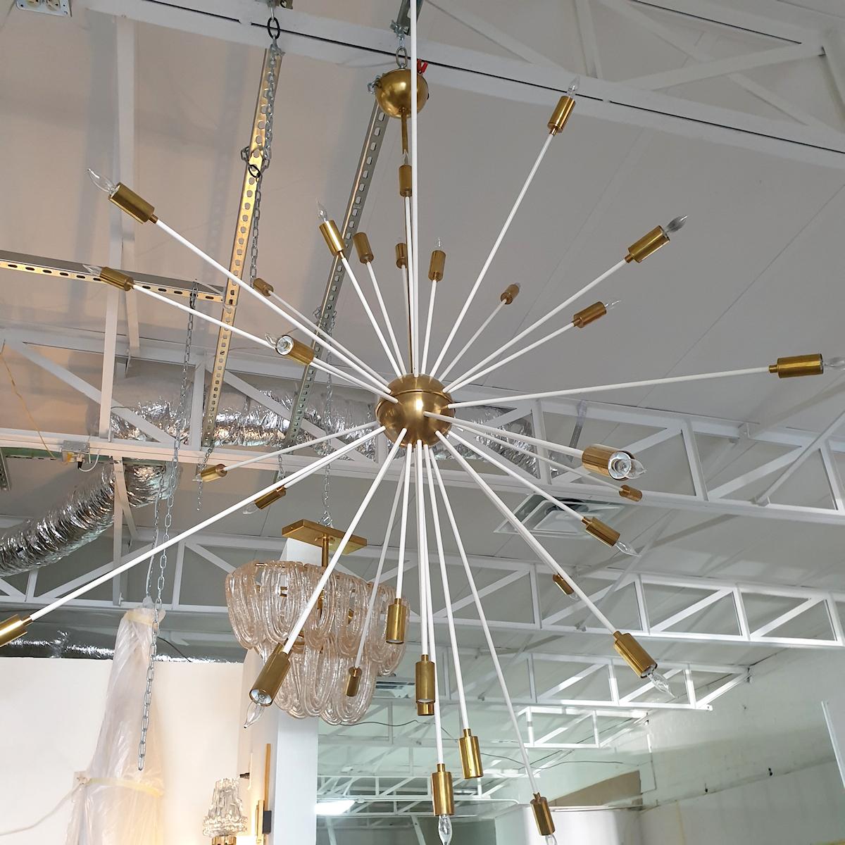 Extra large Mid-Century Modern ivory enamel and brass Sputnik chandelier, Italy, 1970s.
The shape is round, but with different length of stems; giving the chandelier some dynamic impression.
Rewired for the US, with 33 lights.
Can accept any kind