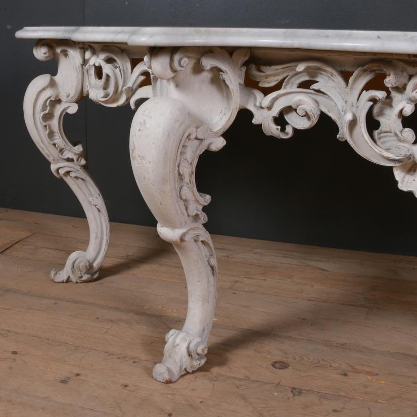 Huge 19th century English carved pine console table with a marble top. Large proportions. Original washed finish, 1850.

Dimensions:
82 inches (208 cms) wide
25.5 inches (65 cms) deep
29 inches (74 cms) high.

 
