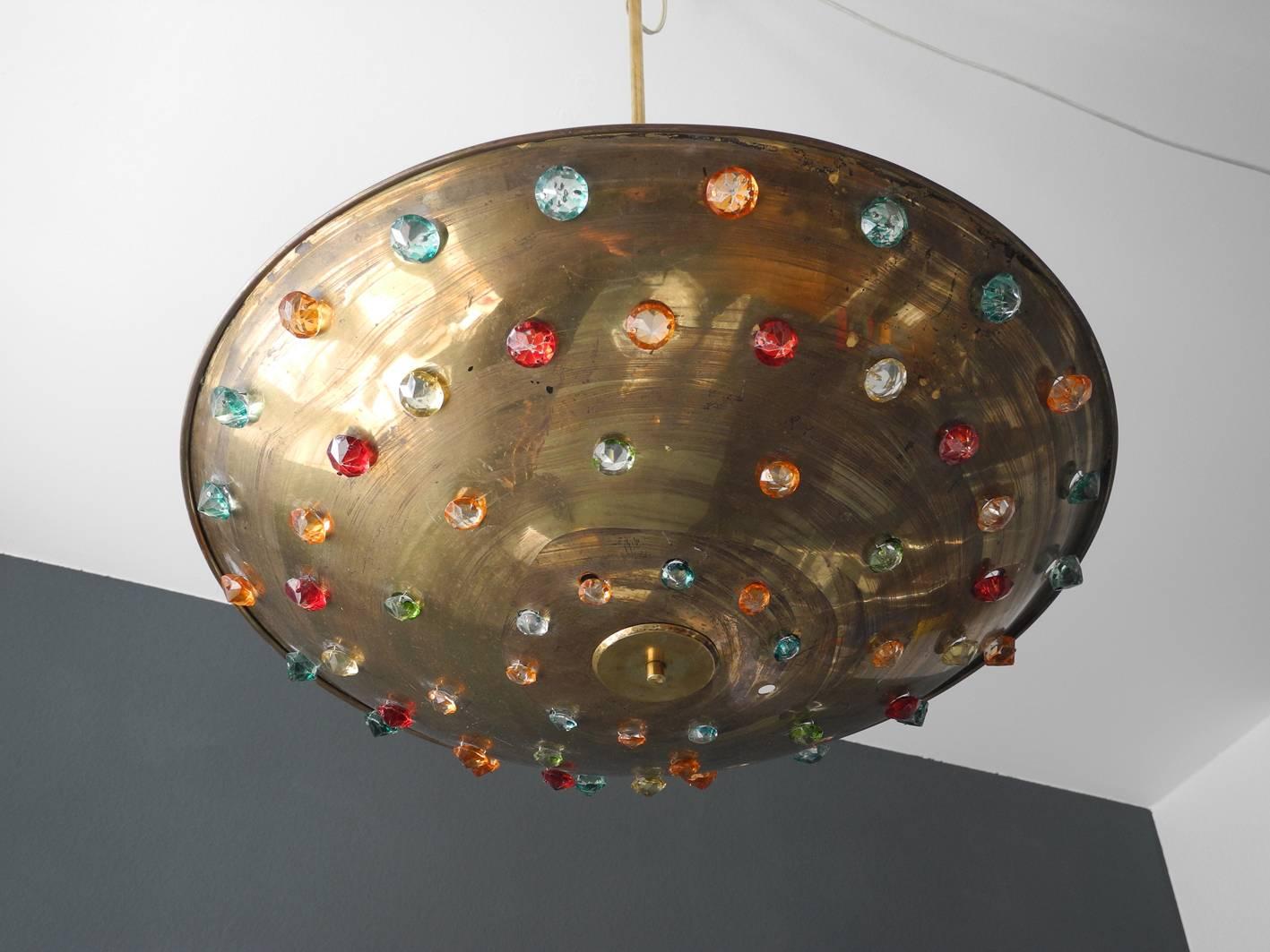 Gigantic extra large midcentury brass ceiling lamp with colorful glass stones. Very rare Minimalist round brass shield, great design for indirect ceiling lighting. With crystal cut large colored glass stones. Probably from an Italian production. A