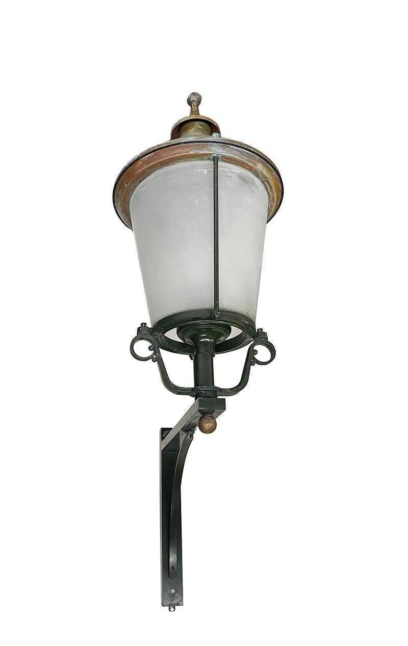 Huge facade outdoor wall mount lanterns lightning , 20th Century

Huge Belgium facade wall lanterns, 20th century
This set of facade lighting has enormous dimensions of approximately 170 cm high (66.9 inches). The glass shade of the lamp is frosted