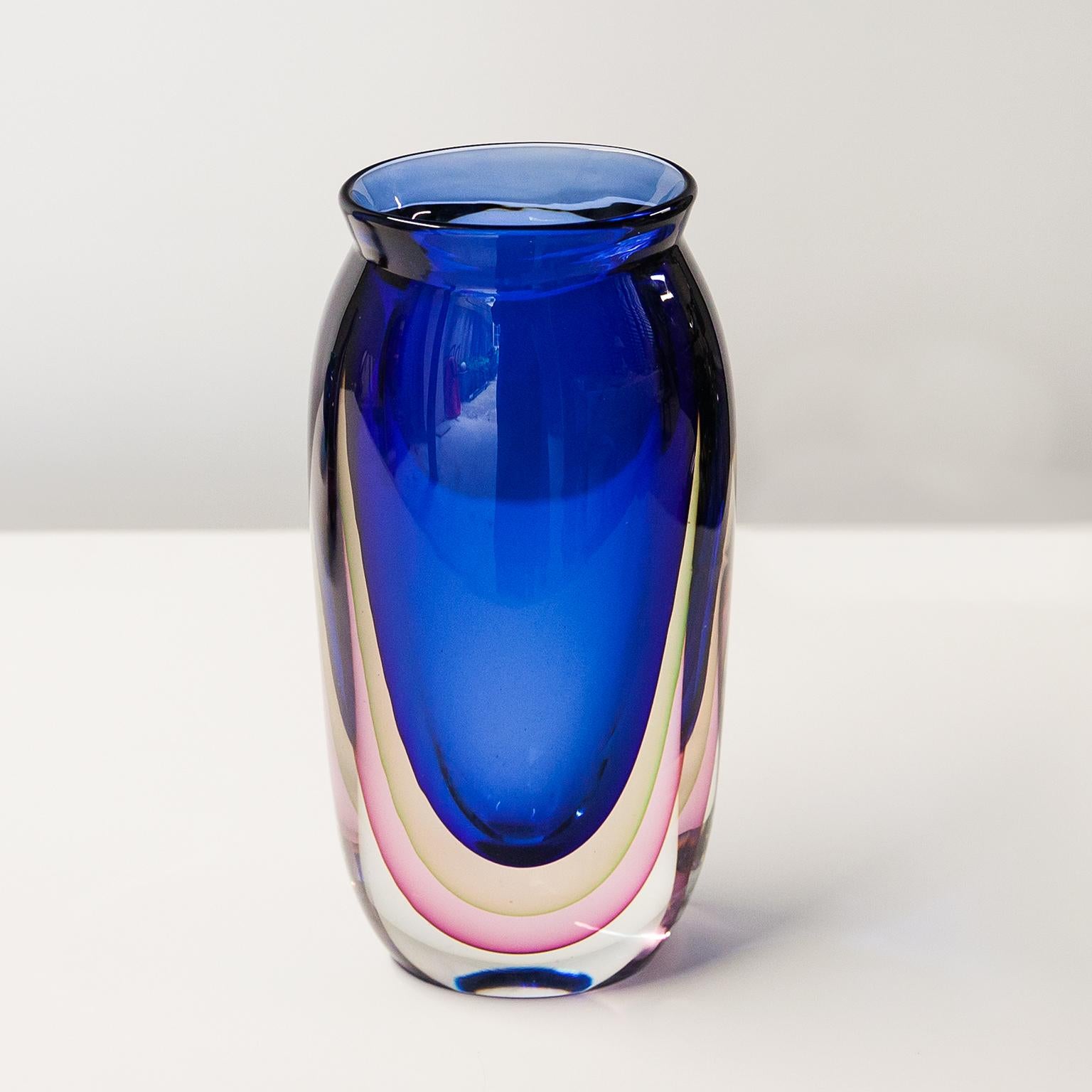 Wonderful and heavy Murano glass vase in bright blue, yellow, pink and clear glass made by Seguso Vetri D’Arte and attributed to Flavio Poli, Italy in the 1960s.

