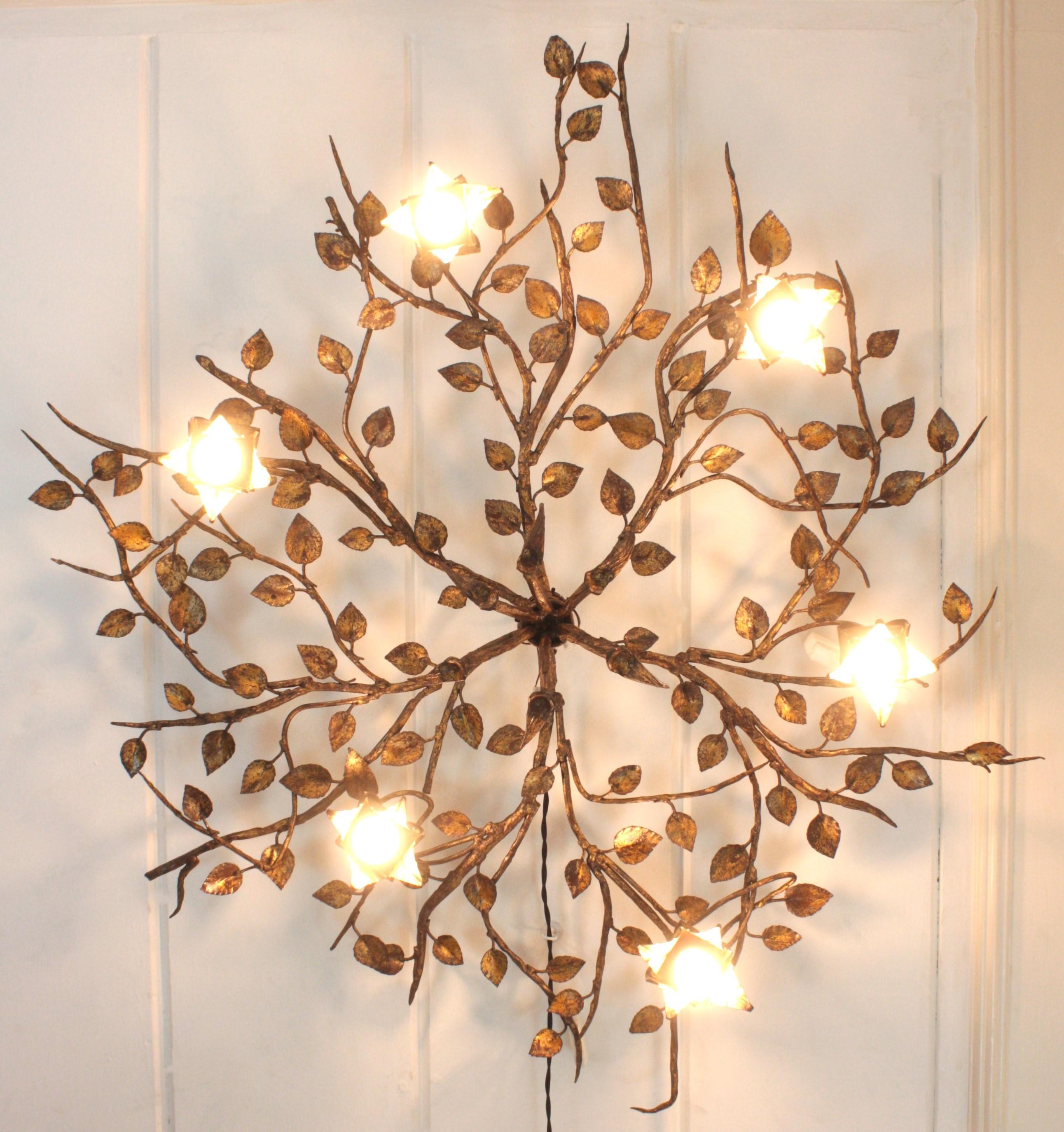 Oustanding  Rosebush Tree Ceiling Flush Mount, Hand Forged Gilt Iron, Spain, 1940s. 
Monumental large size ( 47,24 in ) hand-hammered gilt iron foliage flower bush ceiling light fixture with six flower lights.
This ceiling light fixture was entirely