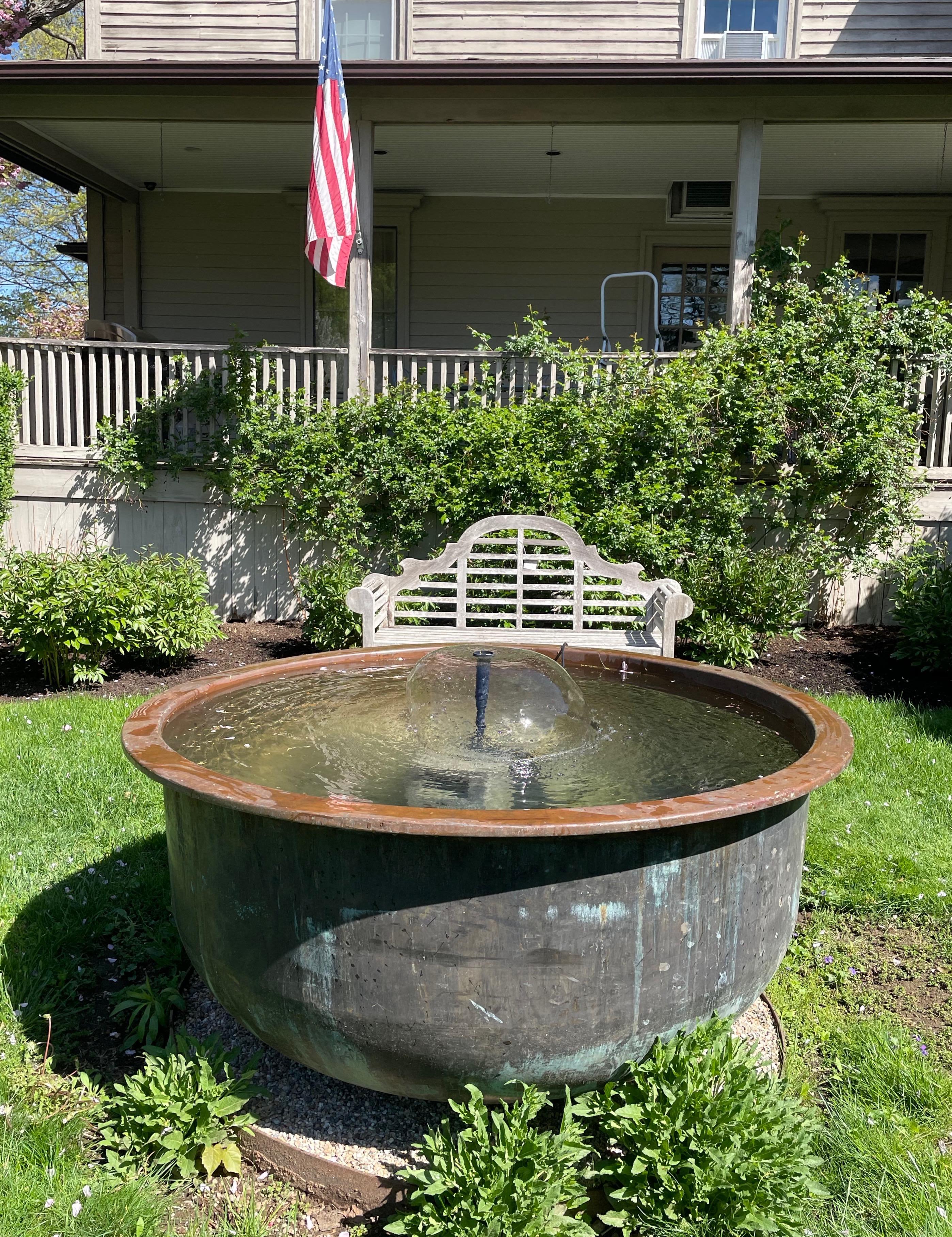 We adore copper cheese vats, particularly since they make such exceptional garden focal points and can serve as fountains, planters, hot tubs or fire pits. This one is stunning and features a beautiful untouched blackened patina with some verdigris