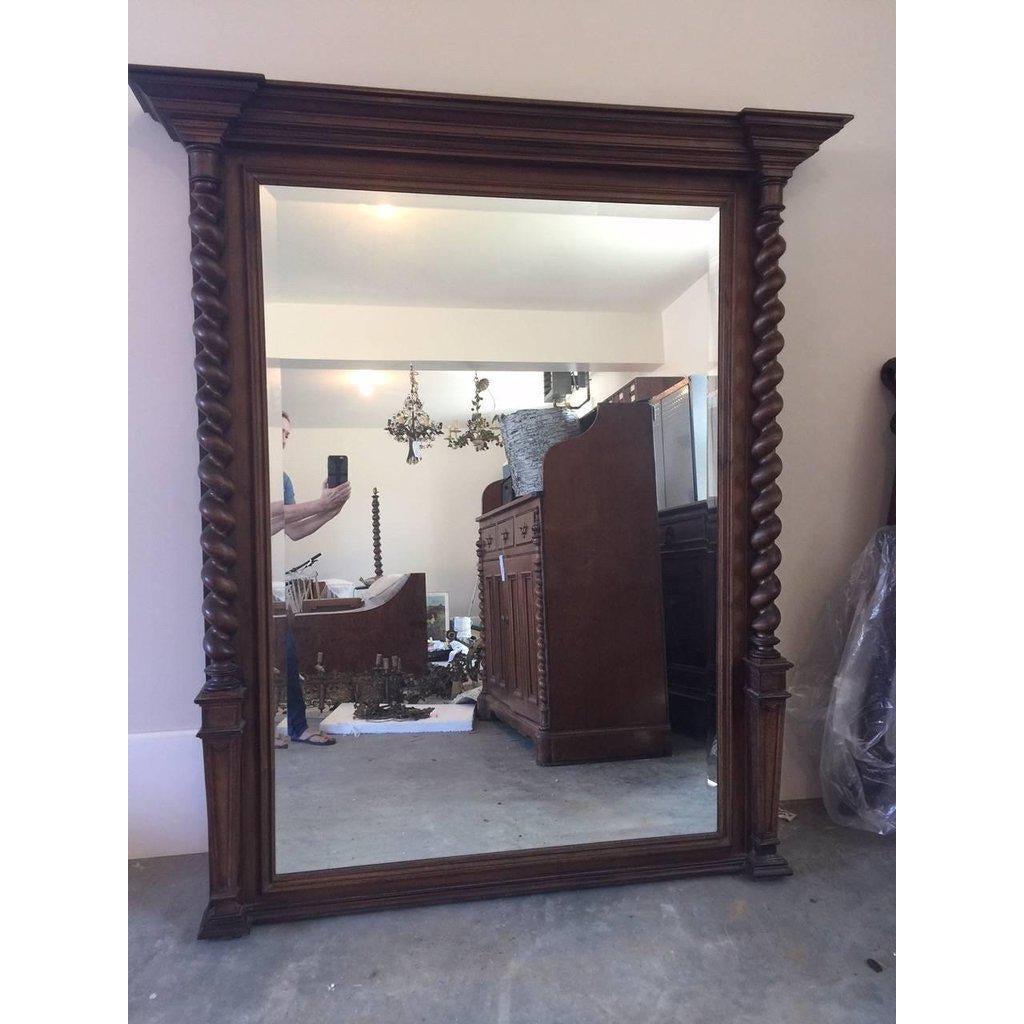 Fabulous French barley twist mirror from the late 1800s, very impressive in scale. The top made from period wood and was added to make it look finished from the top for a two-story entryway. Mirror is bevelled.
 