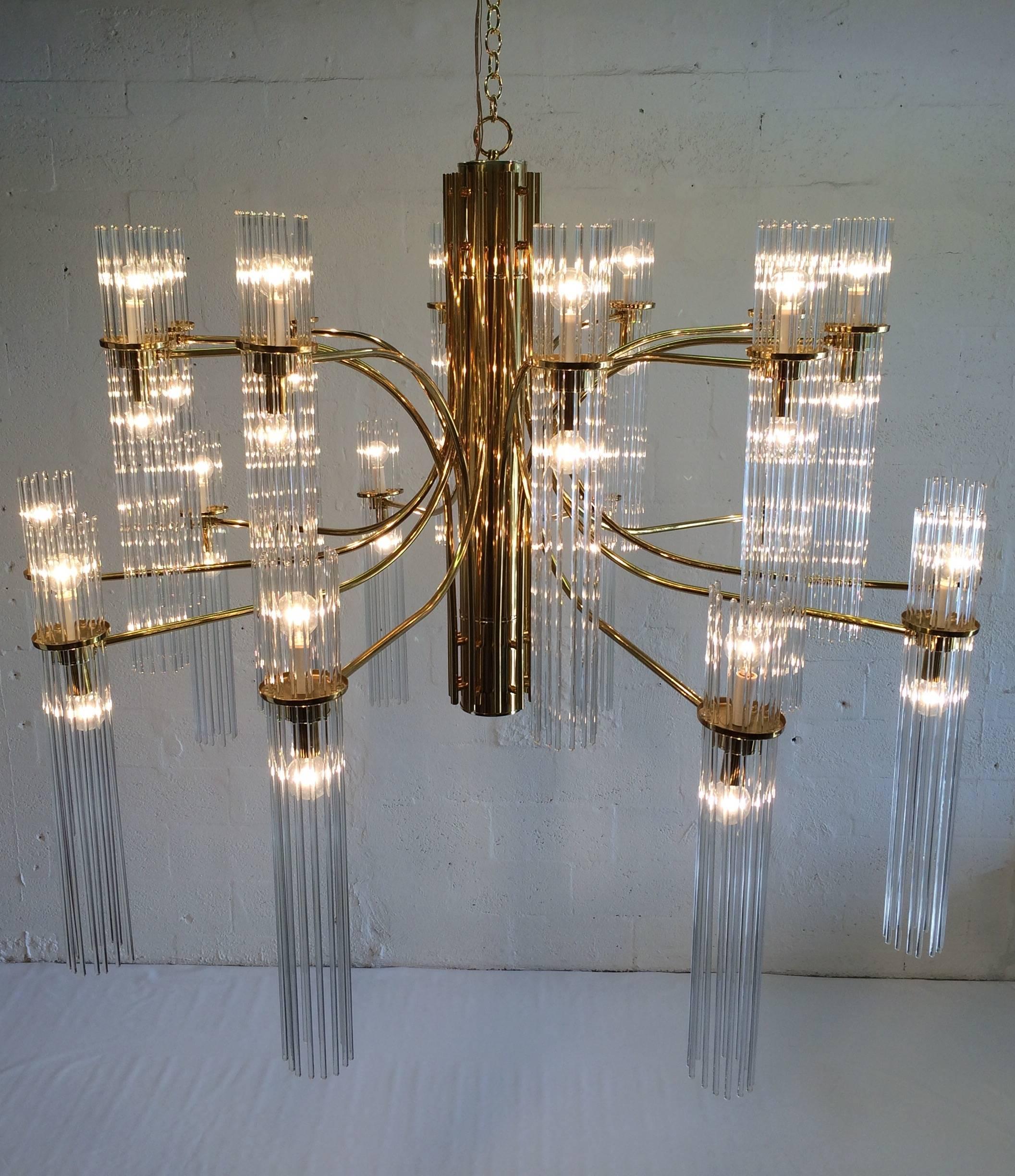 Huge brass and glass chandelier, 50” in diameter, chandelier has 20 arms with 260 glass rods.