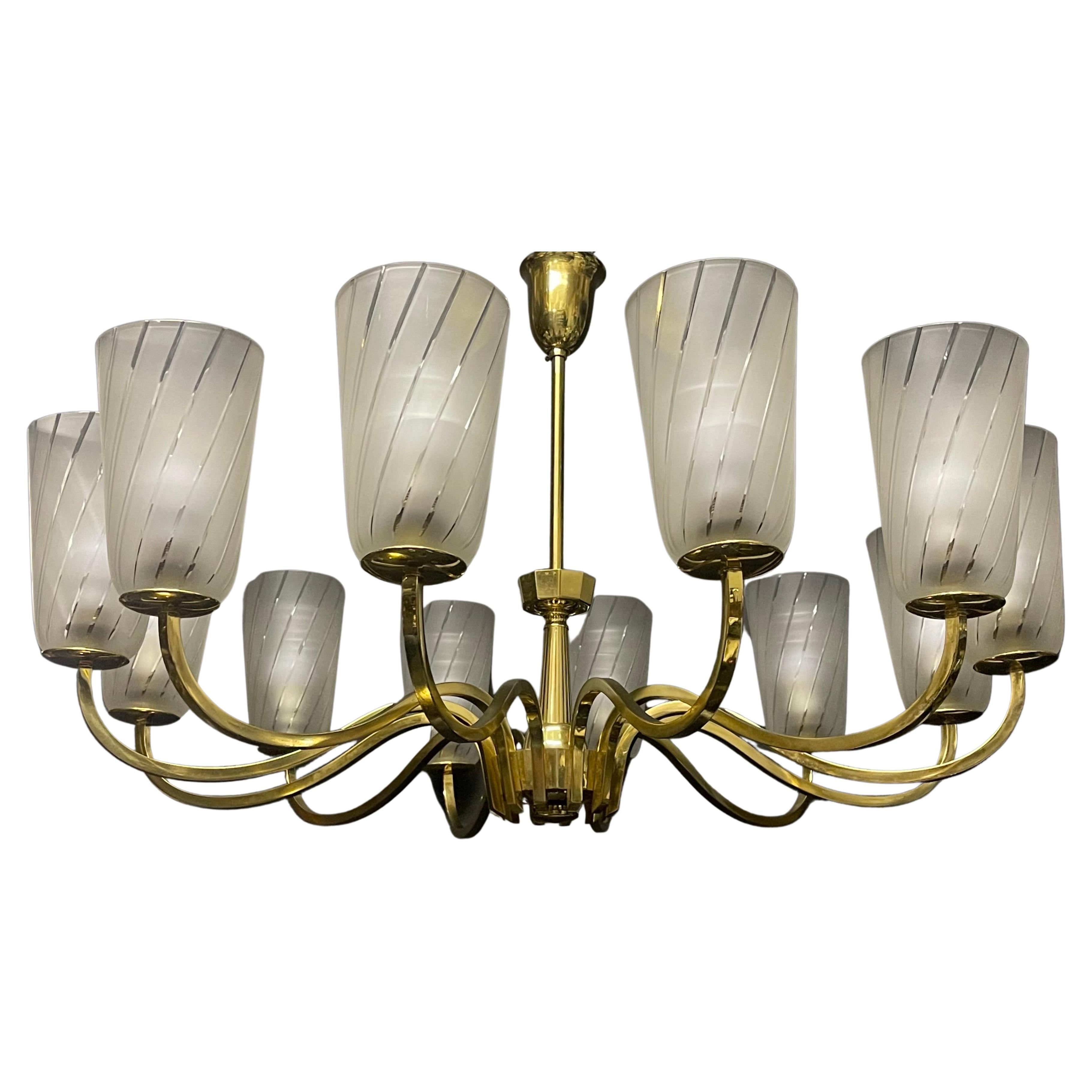 A huge Art Deco German polished brass and striped frosted glass chandelier, 1930s.
Socket: 12 x e27 or E26 (also for US standards).
The condition is excellent.