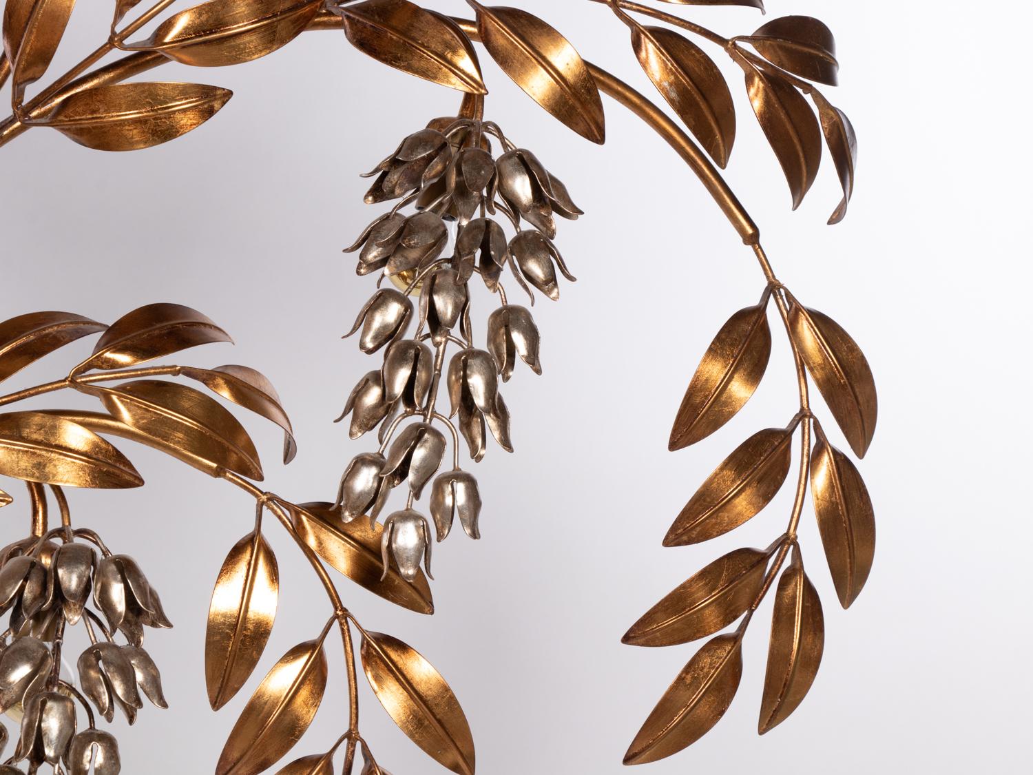 Monumental 'Pioggia D'oro' wall light made by Hans Kögl in Germany in the 1970s.
Large gold-plated leaved branches with hanging silver wisteria flowers.

Measures: width. 51