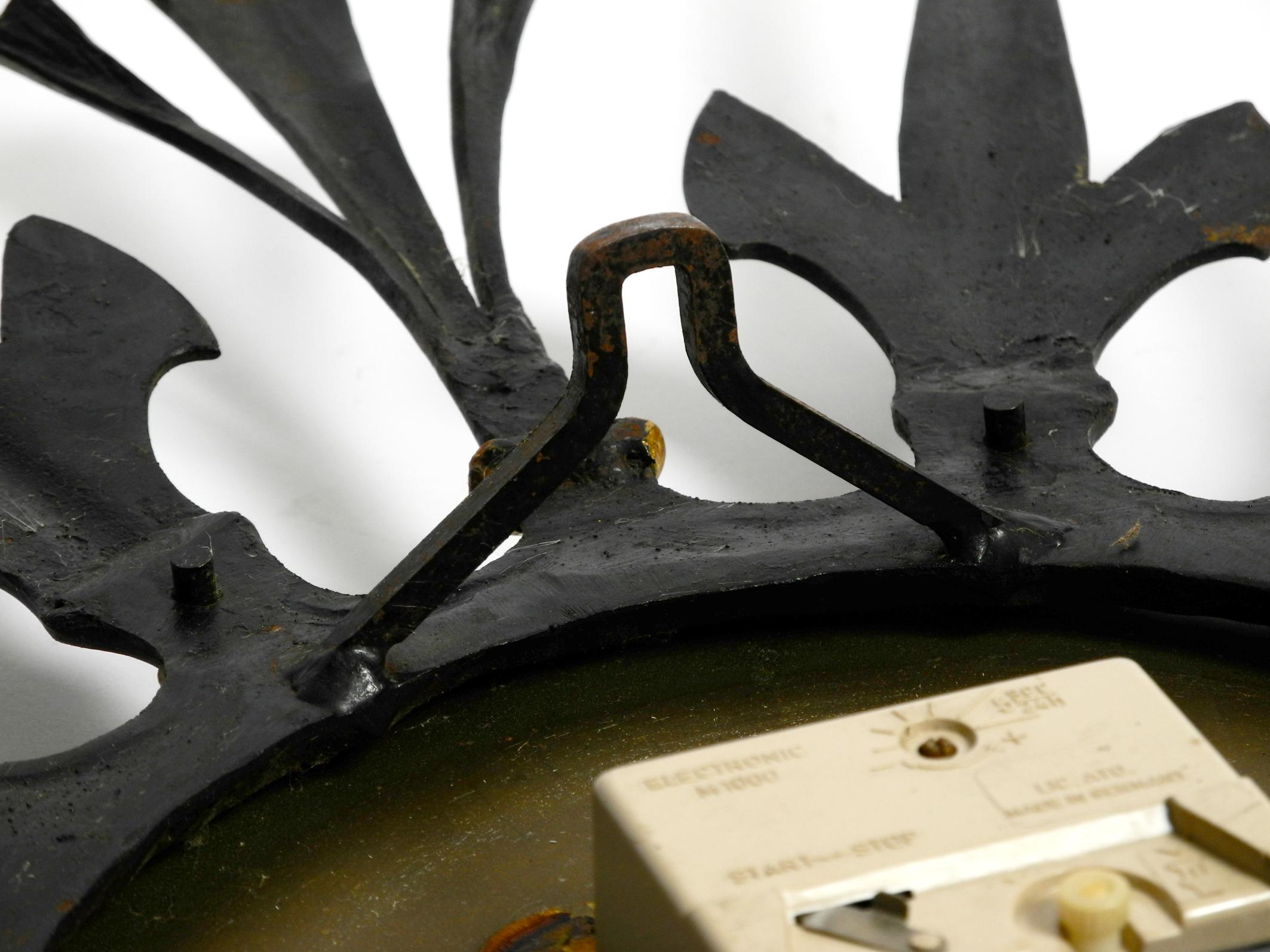 Huge, Heavy, Unusual 60s Sunburst Wall Clock Made of Wrought Iron by Kienzle In Good Condition In München, DE