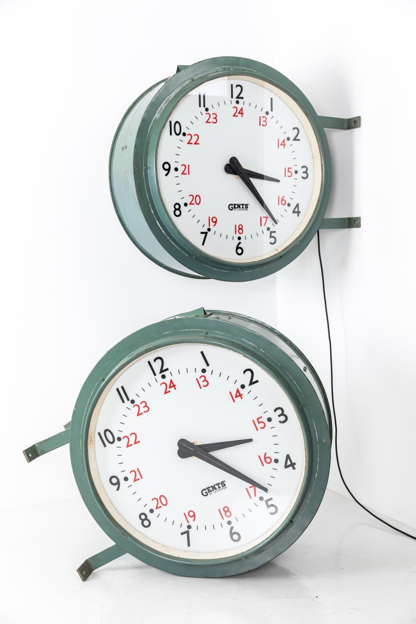 

An incredible pair of large illuminated railway clocks made in England by Gents of Leicester. c.1930

Believed to have originally hung in Cardiff Central railway station. Double sided wall mounted drum clocks in fantastic original condition.