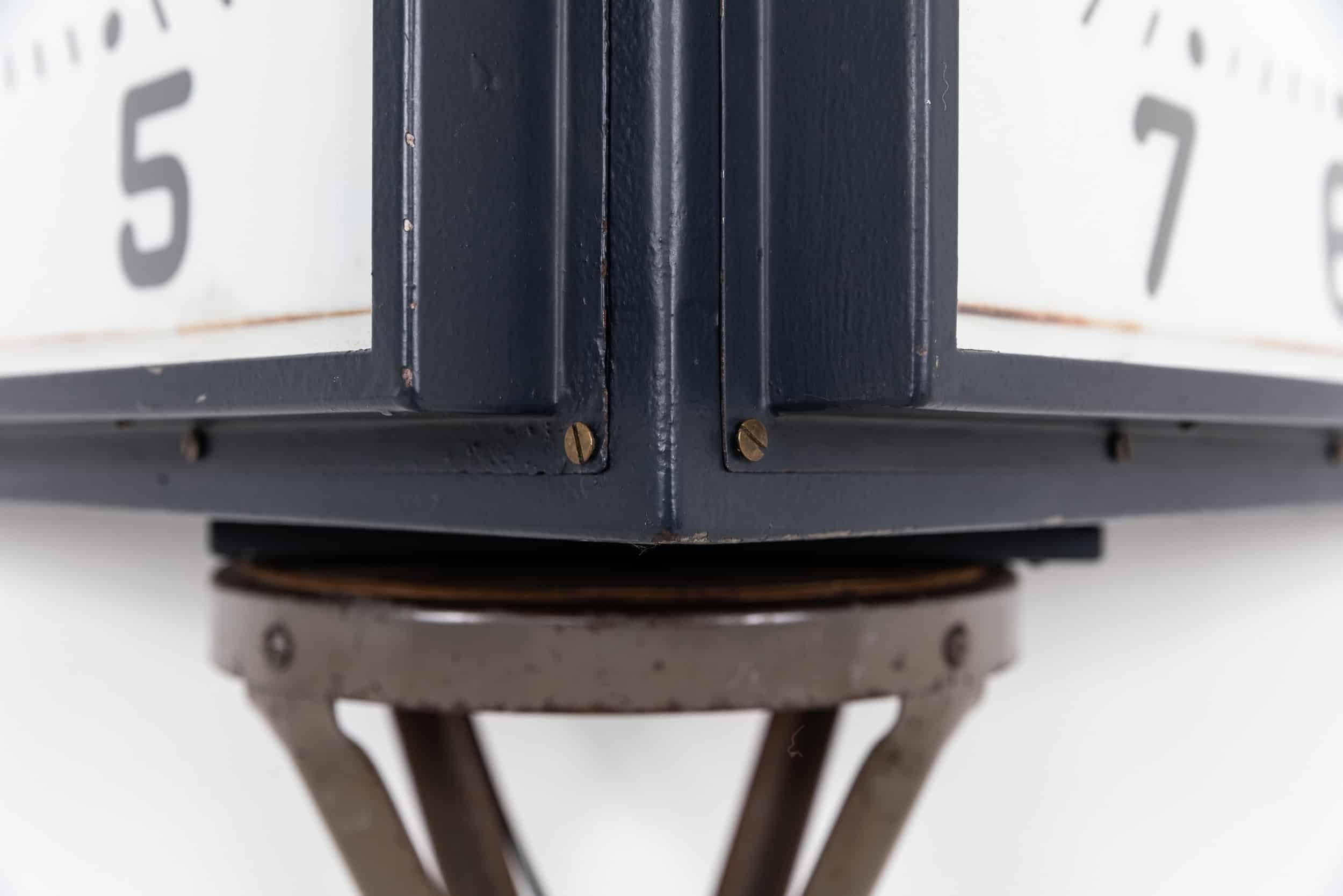 An incredible and large illuminated double faced wall clock made in England by Gents of Leicester. c.1930

Double sided wall mounted in fantastic condition in old dark blue paint. Gents' iconic hands running on modern 240v mechanisms, with the