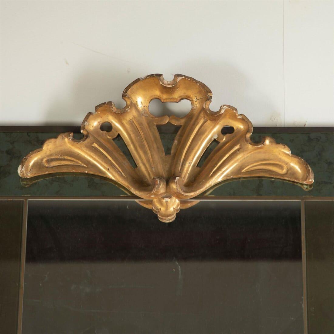 A stunning scale Italian sectional mirror with green glass border and stylized gilt crest, circa 1960.