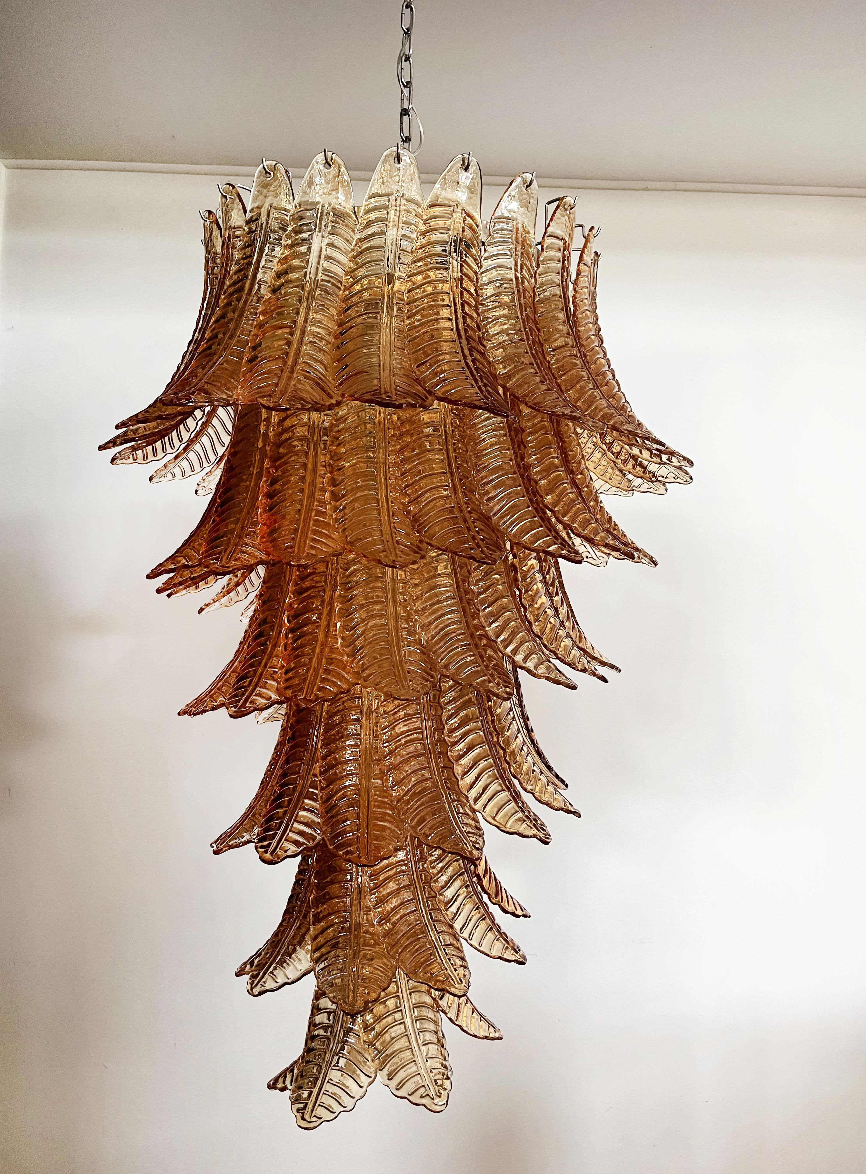 Beautiful and huge Italian Murano Chandelier composed of 83 splendid amber glasses that give a very elegant look. The glasses of this chandelier are real works of art. The glasses descend with a spiral shape.
Dimensions: 71,70 inches (185 cm)