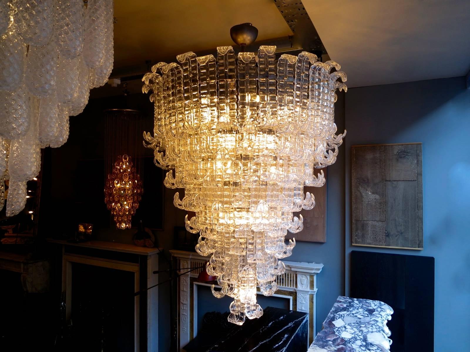An enormous chandelier in Murano glass on a steel frame with brass ball fittings, very well made and very good quality. Imported from Italy.