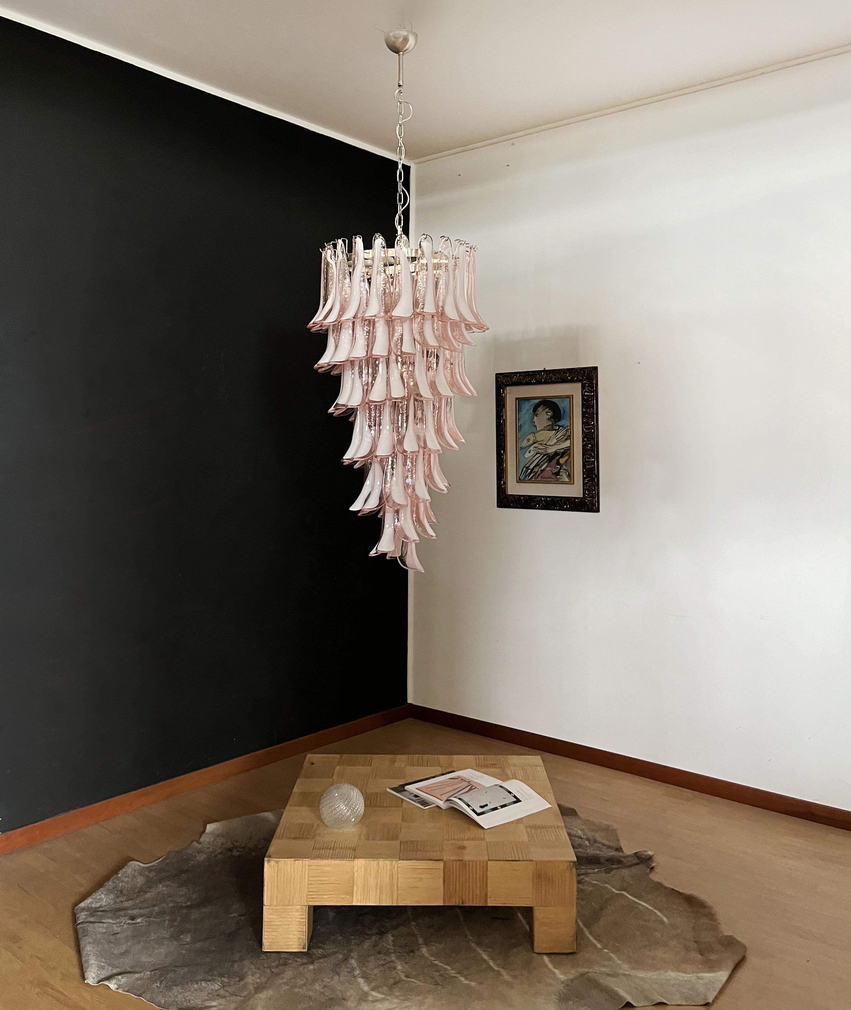 Beautiful and huge Italian Murano Chandelier composed of 83 splendid glass petals (pink and white “lattimo”) that give a very elegant look. The glasses of this chandelier are real works of art. The glasses descend with a spiral shape.
Dimensions: