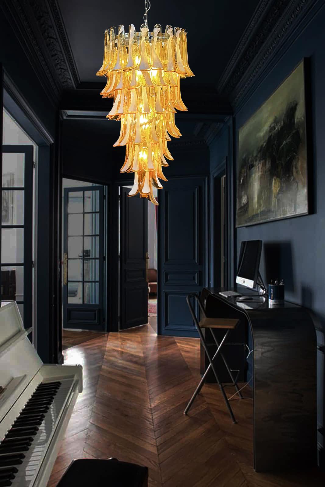 Beautiful and huge Italian Murano Chandeliers each composed by 83 splendid glass petals (amber with white spot) that give a very elegant look. The glasses of this chandelier are real works of art. The glasses descend with a spiral shape.
Dimensions: