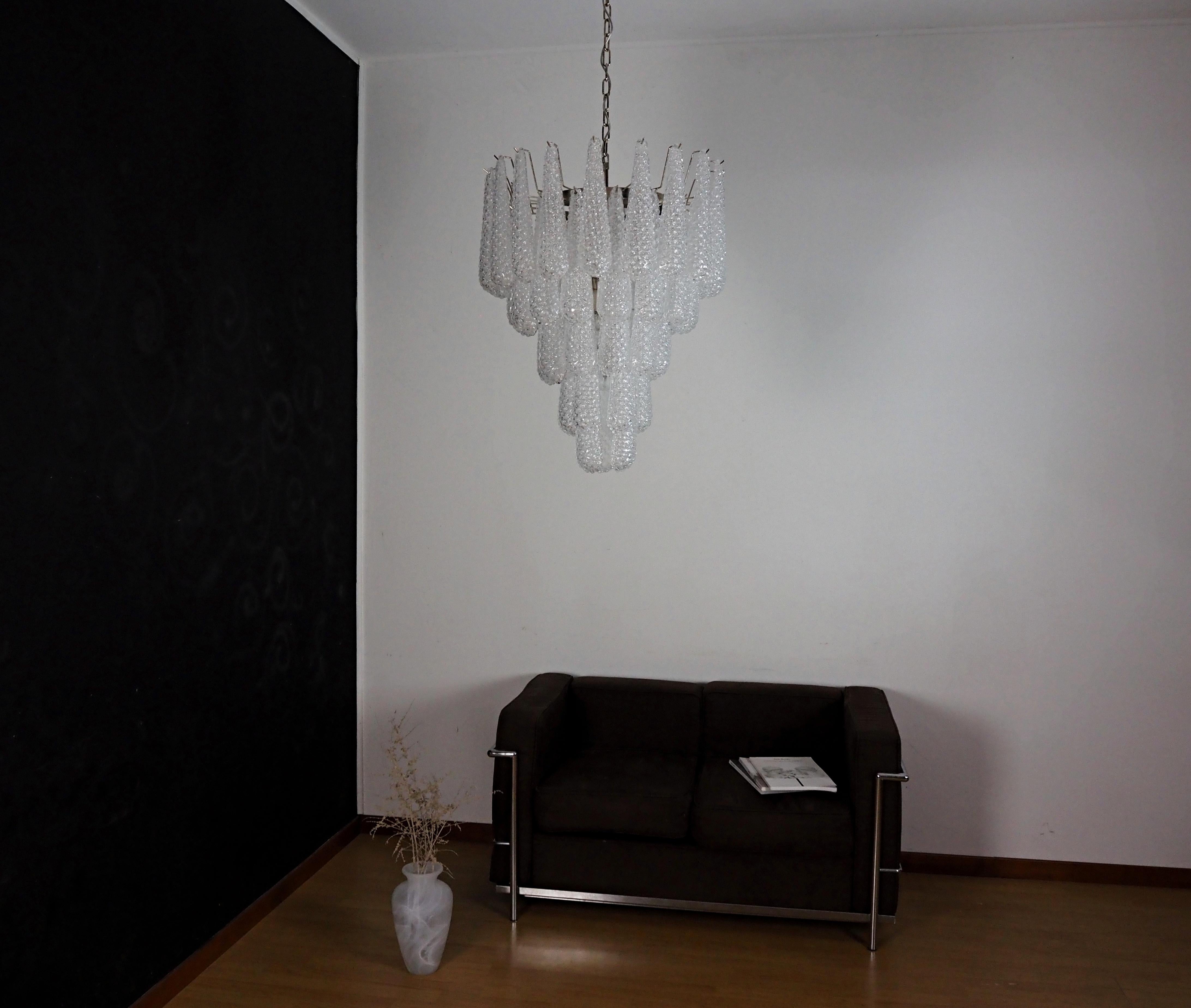 Huge Italian vintage Murano chandelier made by 52 glass petals (transparent crystal, smooth outside, with crystal powder and then rough inside.) in a chrome frame.
Period:  late XX century
Dimensions:  55,10 inches (140 cm) height with chain; 29,50