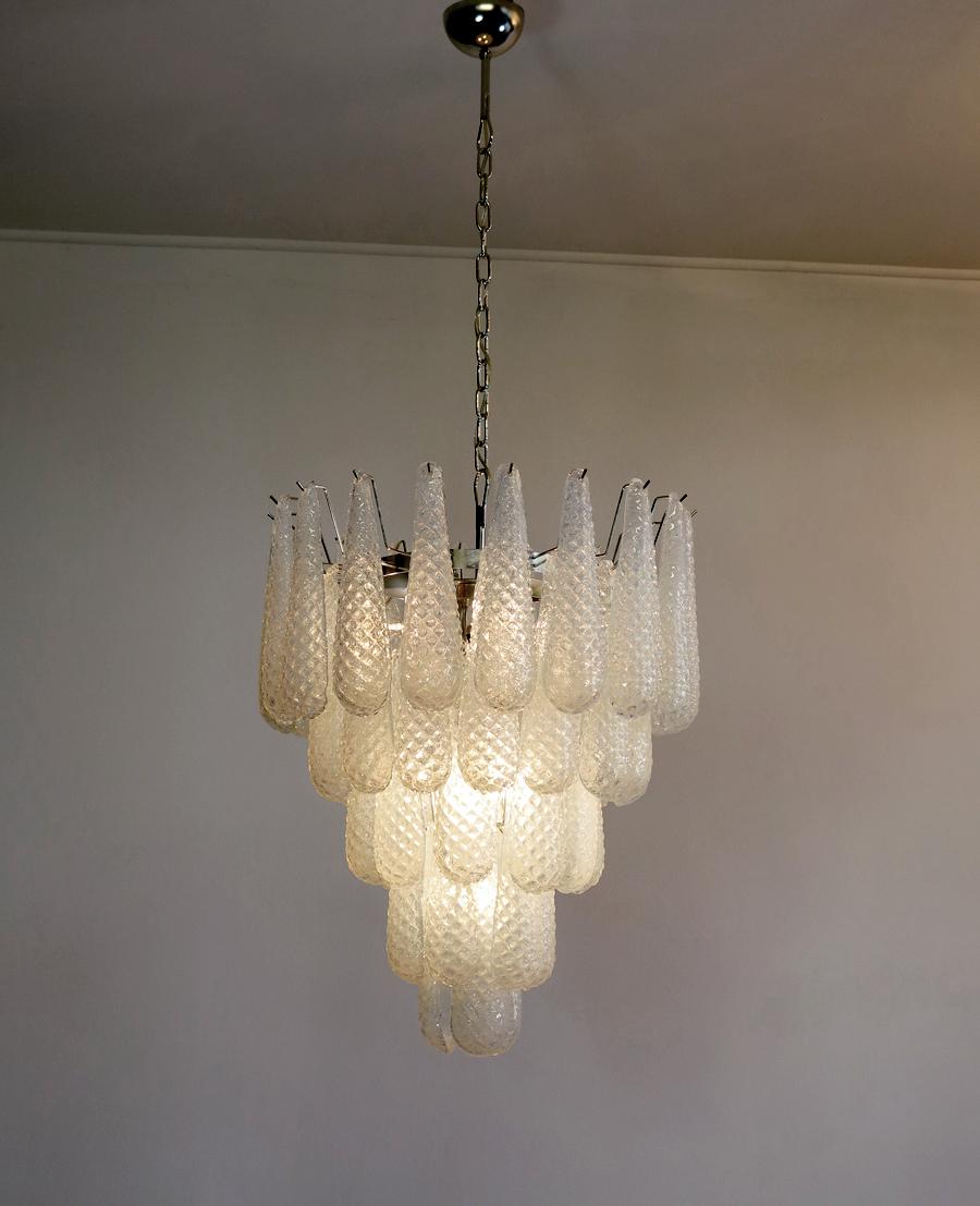 Huge Italian vintage Murano chandelier made by 52 opalino glass petals. The originality of this chandelier is given by the glass, wonderful works of art in opal glass, white inside and with transparent blue reflections on the outside.  The glasses