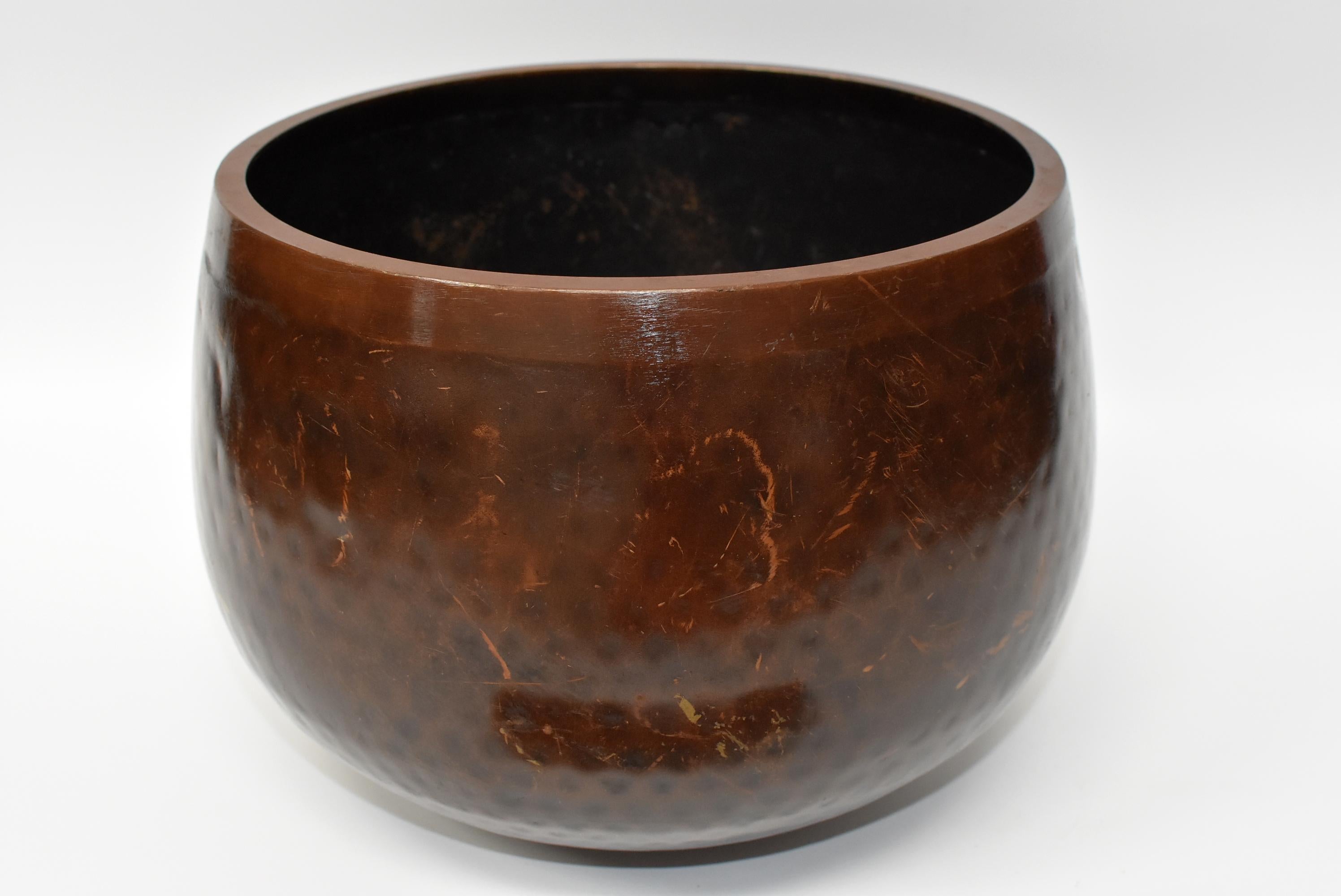 This is huge, substantial, handmade bowl that is in copper finish. The material is solid bronze. Beautiful dimpled texture in beehive pattern is hand-hammered. All patina is original. This bowl makes the most beautiful, enlightening, deep sound that