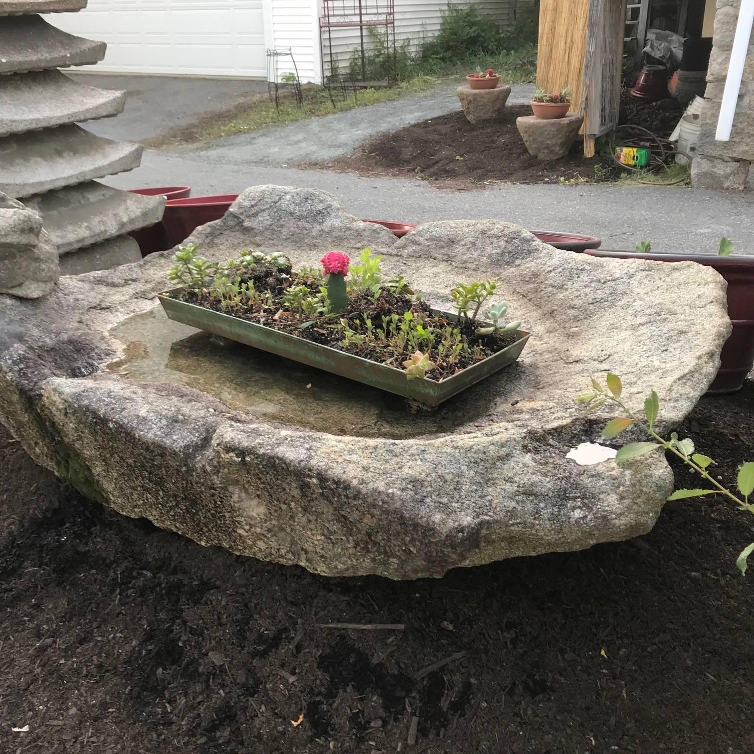 Japan, a stunning and unique large antique naturally formed solid granite stone reflecting pool style water basin -tsukubai- sourced from a rivers edge replete with its original natural rough external side elements as shown.

One of a kind and