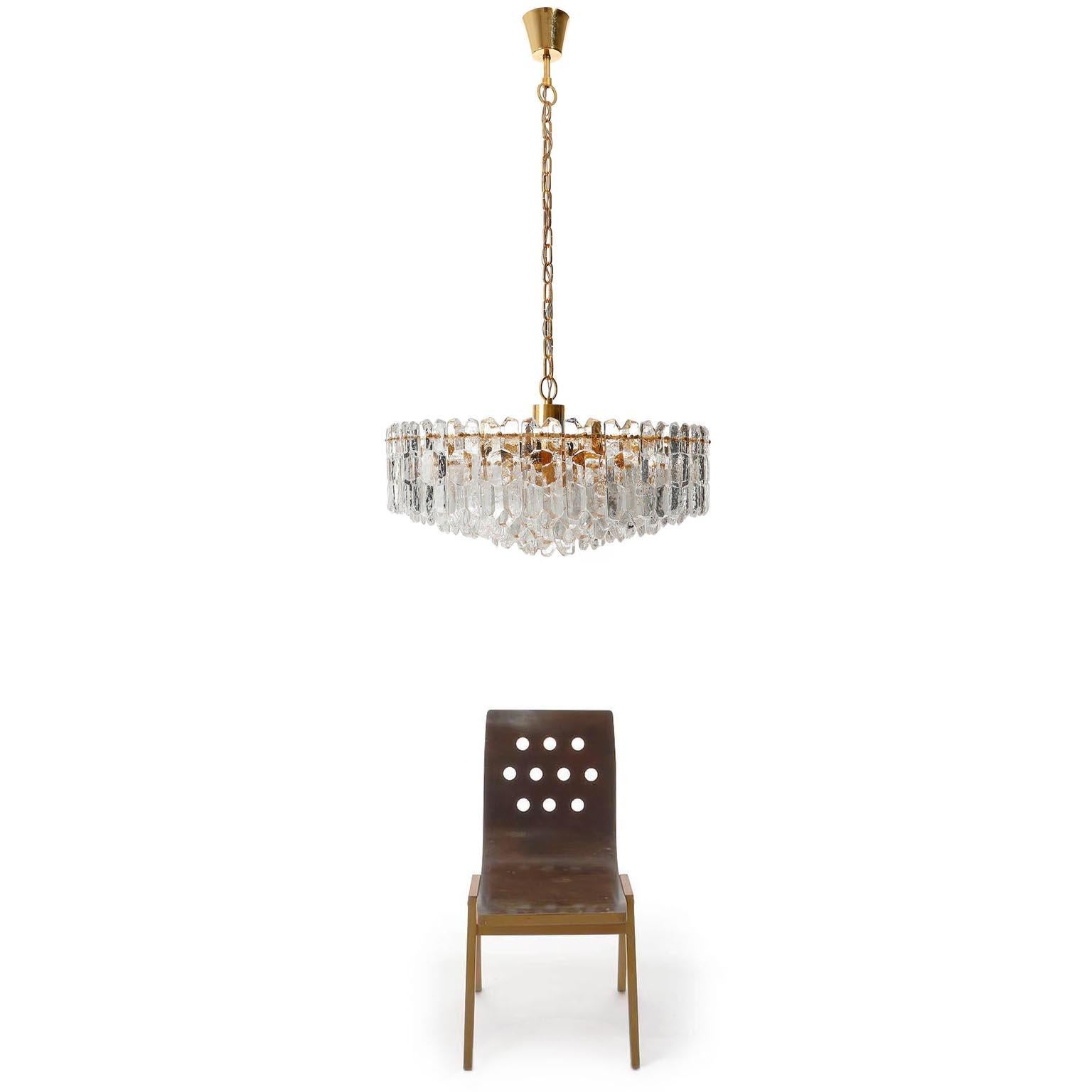 An extra large and very exquisite 24-carat gold-plated brass and clear brilliant glass 'Palazzo' chandelier by J.T. Kalmar, Vienna, Austria, manufactured in circa 1970 (late 1960s and early 1970s).
The fixture is labeled and documented in the