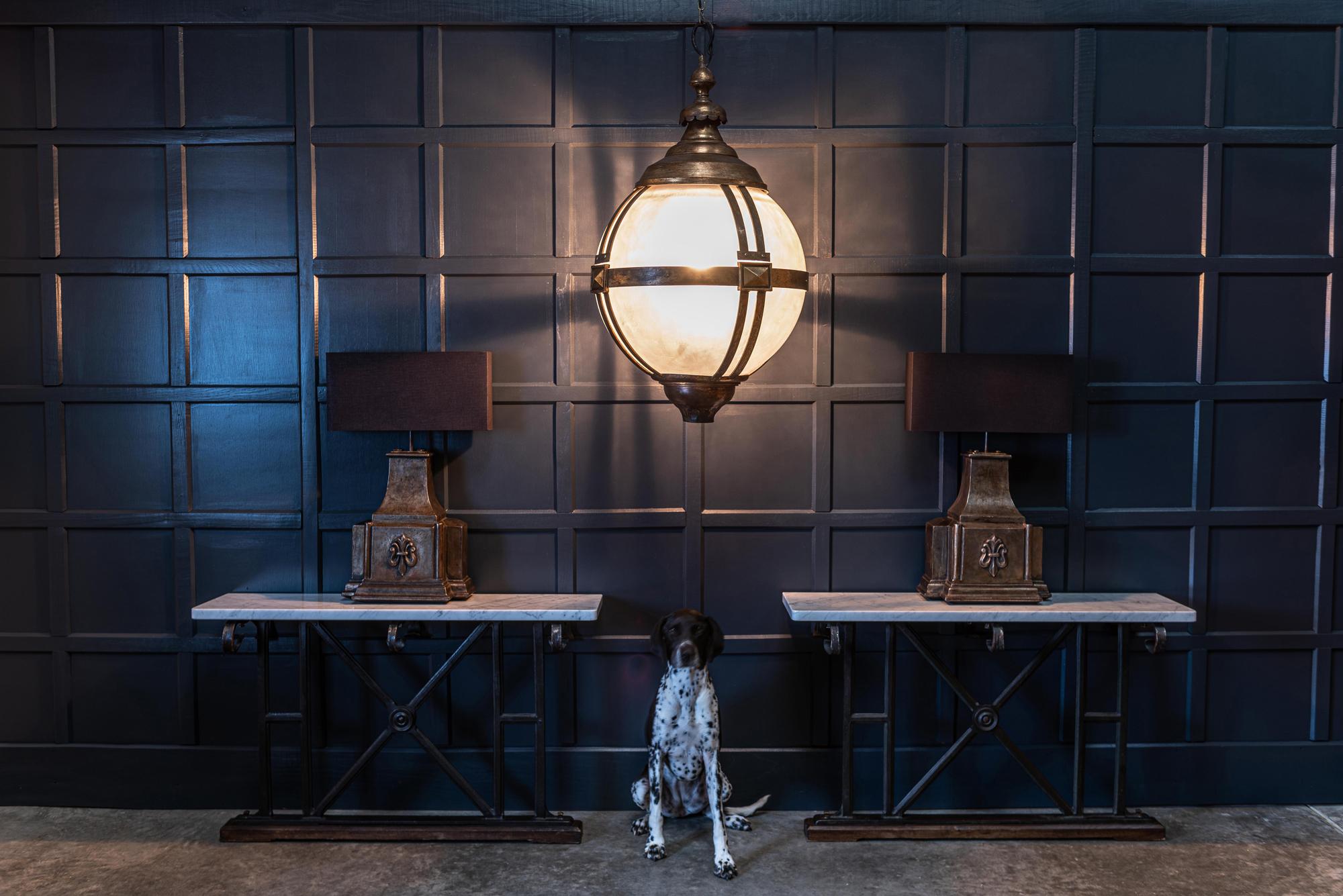 Huge London Westminster, street globe pendant lantern,
circa 1980.

Reclaimed and adapted in collaboration with our Artisan Blacksmith into a centre piece lighting pendant.

A hand forged threaded shepherds crook runs through the centre of the