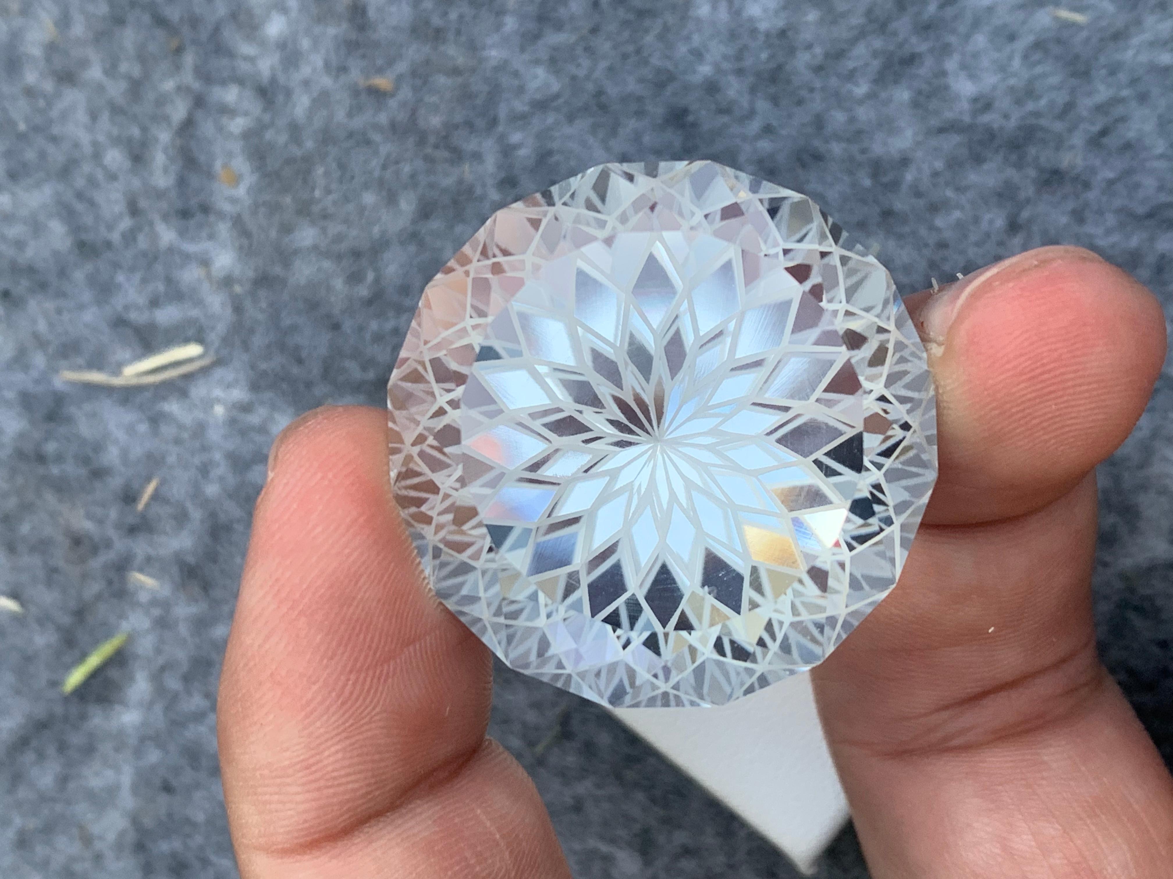 Loose Crystal Quartz 
Weight : 125.40 Carats 
Dimensions : 32x32x23 Mm
Origin : Brazil 
Clarity : AAA Eye Clean 
Shape: Round Shape 
Facet: Flower Cut 
 Certificate: On Demand 
Treatment: Non 
Color: Colorless 
Quartz crystal is a power stone that's