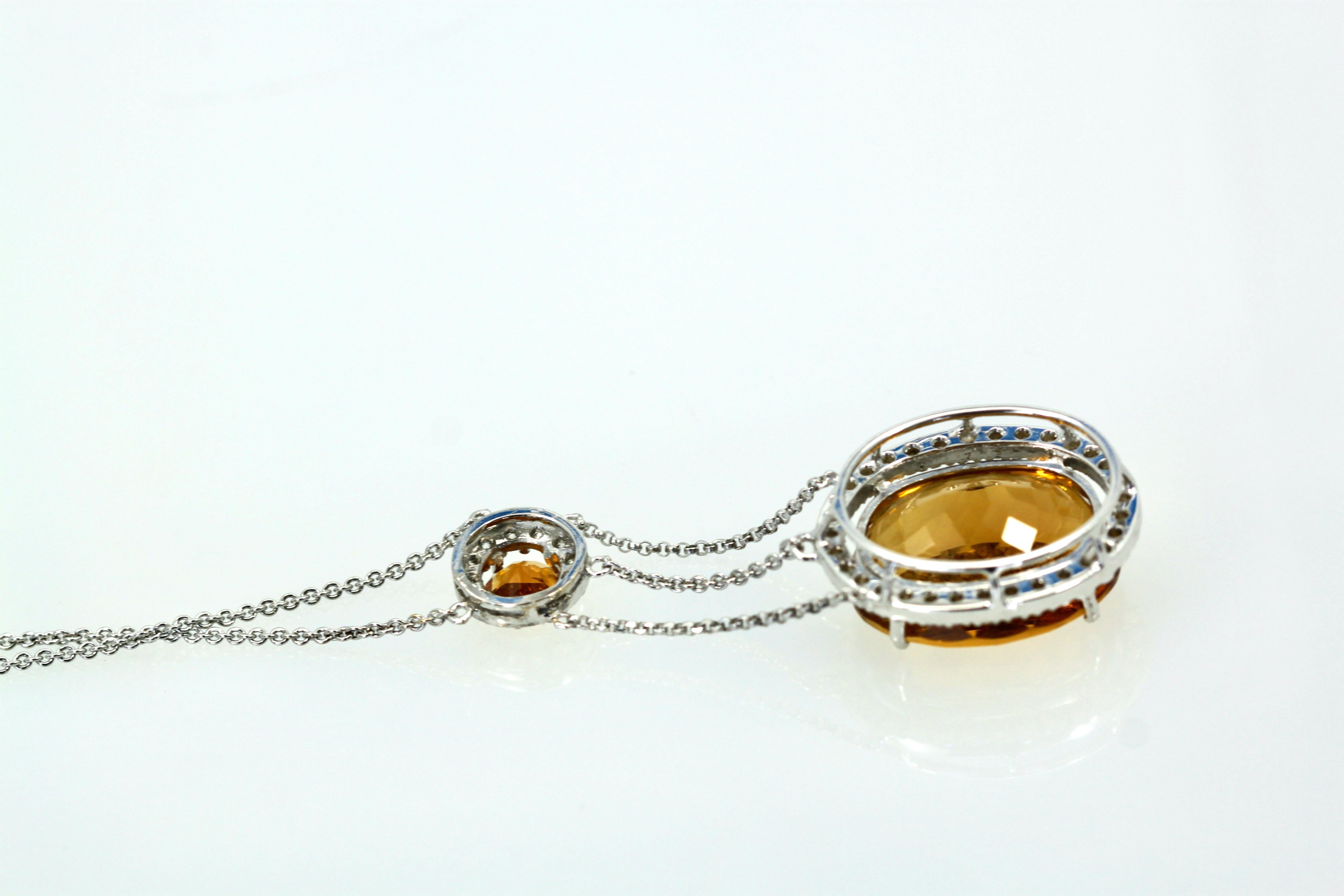 This gorgeous mixed cut Madeira Citrine is huge and beautiful.  This necklace is a drop style with a 1.50 carat round Citrine and a large oval Citrine drop with a Diamond surround. This large Citrine comes from Brazil and is gorgeous it measures