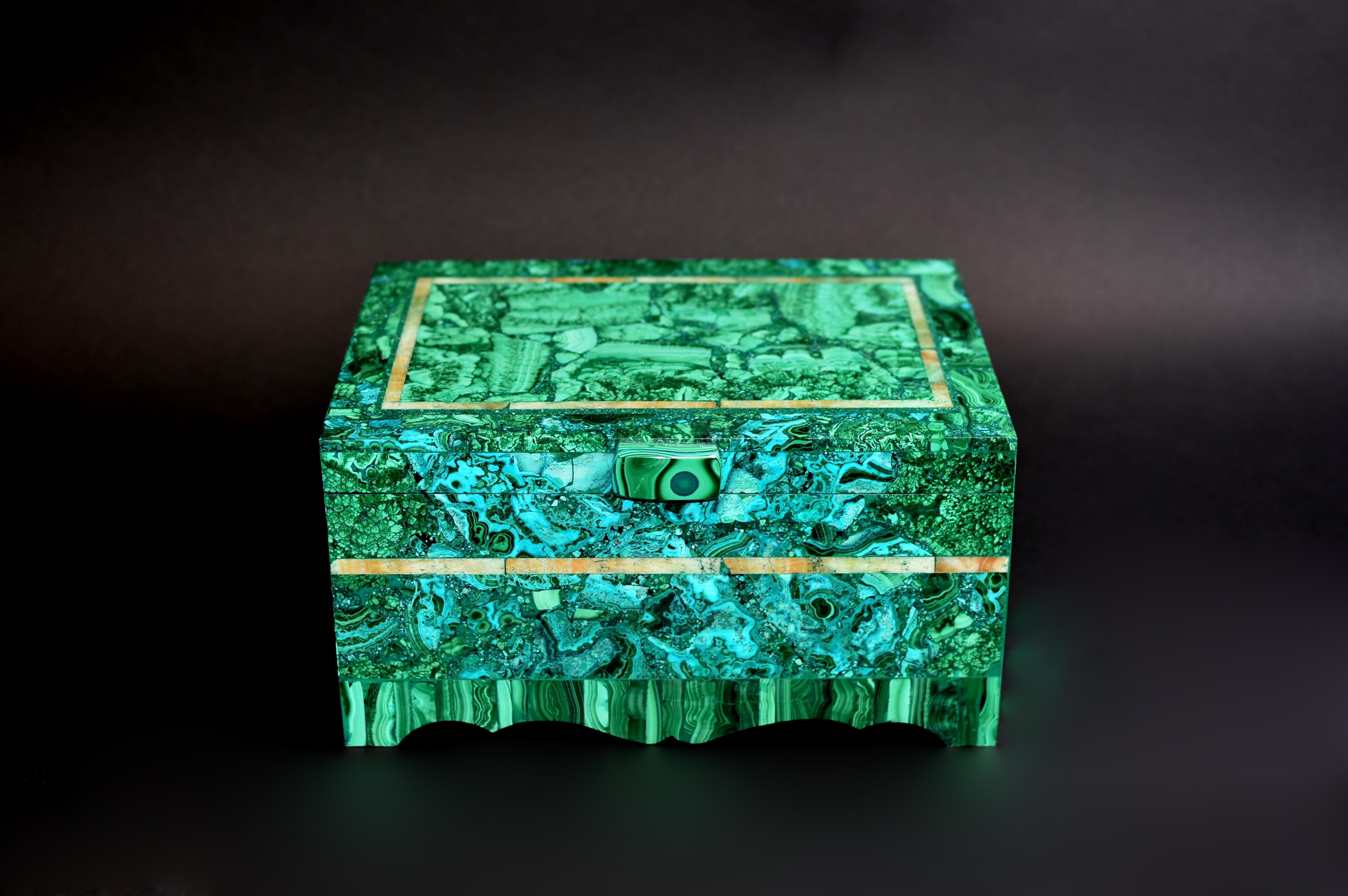 A truly exceptional extra large malachite jewelry box. On raised feet the box with malachite of various patterns and spectacular natural vein of blue chrysocolla. Malachite ranges from light to dark green, in a rare case, exhibits a vein of blue