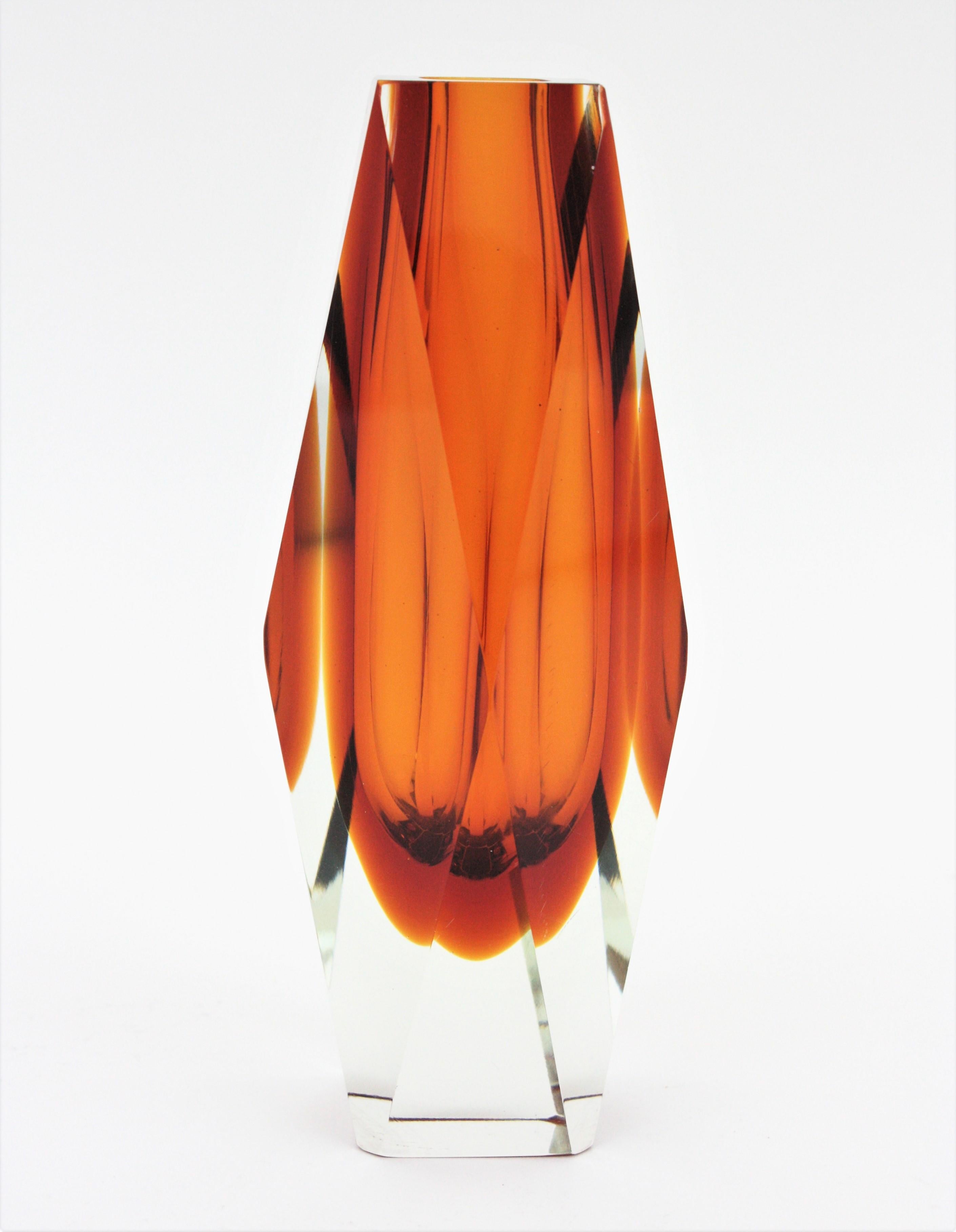 A gorgeous extra large Sommerso faceted orange and clear Murano glass vase. Attributed to Mandruzzato. Italy, 1950-1960.
Faceted Murano glass with sommerso technique in two tons of orange cased into clear glass.
Gorgeous placed as a part of a set