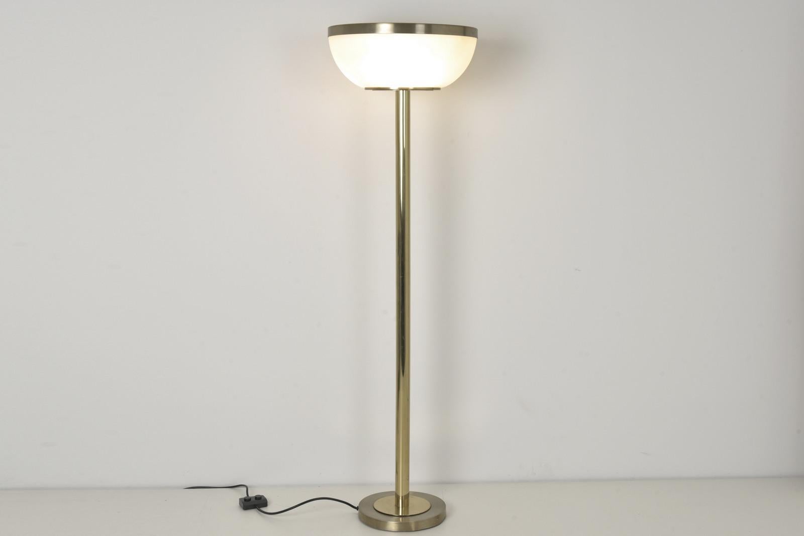 H 170 cm W 50 cm D 50 cm

Material: Base cast iron, aluminium gold anodized and lacquered, brass protective lacquered, reflector frosted glass frosted on one side outside, original foot switch 2-way switchable, connection cable white, 1 x 3 sockets