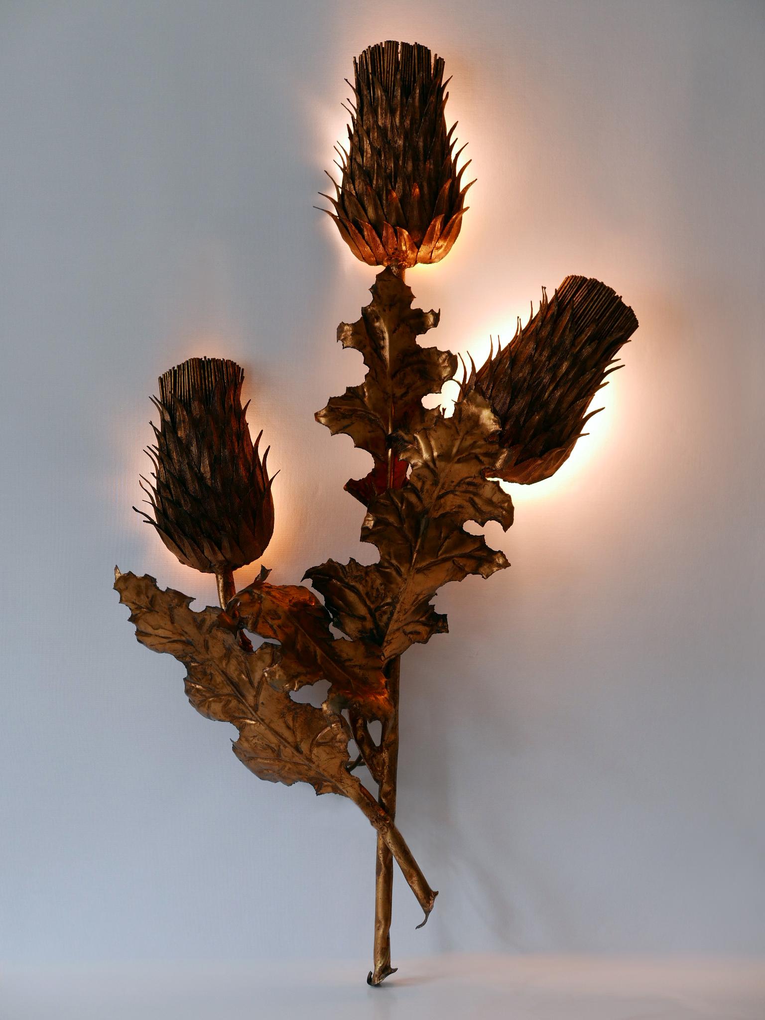 Exceptional, huge and highly decorative Mid-Century Modern three-flamed 'Thistle Flower' sconce. Designed & manufactured in Germany, 1960s.

Executed in gilt metal, the sconce comes with 13 x E14 / E12 Edison screw fit bulb holders, is wired, in