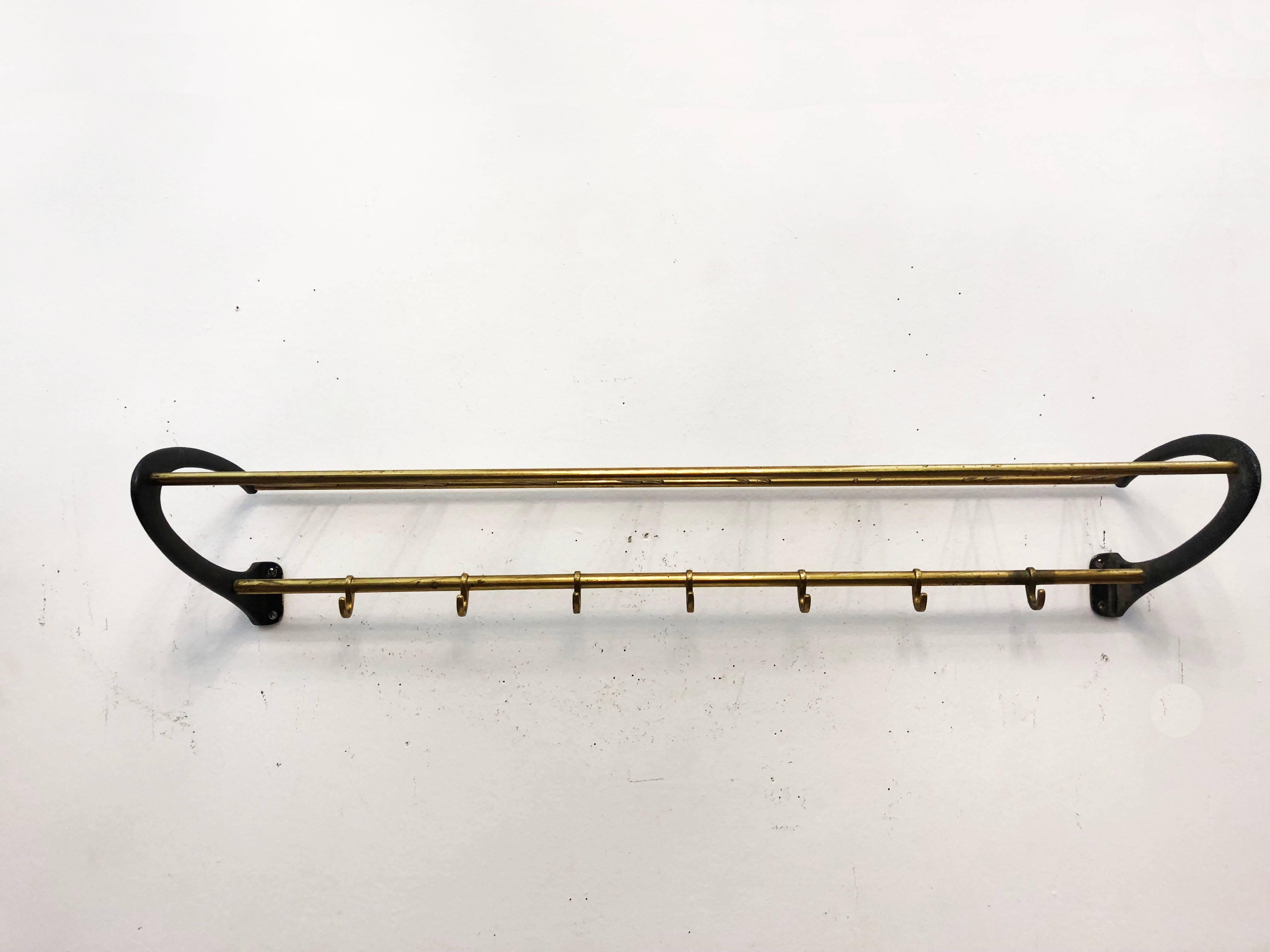 Brass construction with blackened aluminum brackets in the style of Carl Auböck. Made in Austria in the 1950s.