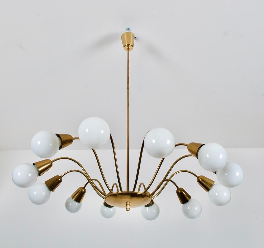 Brass construction with twelve-arm each normally fitted with white globe shaped E27 sockets (like on the pictures). Made in Vienna by Rupert Nikoll in the early 1950s.
Measures: Diameter without bulbs 75cm (29.52