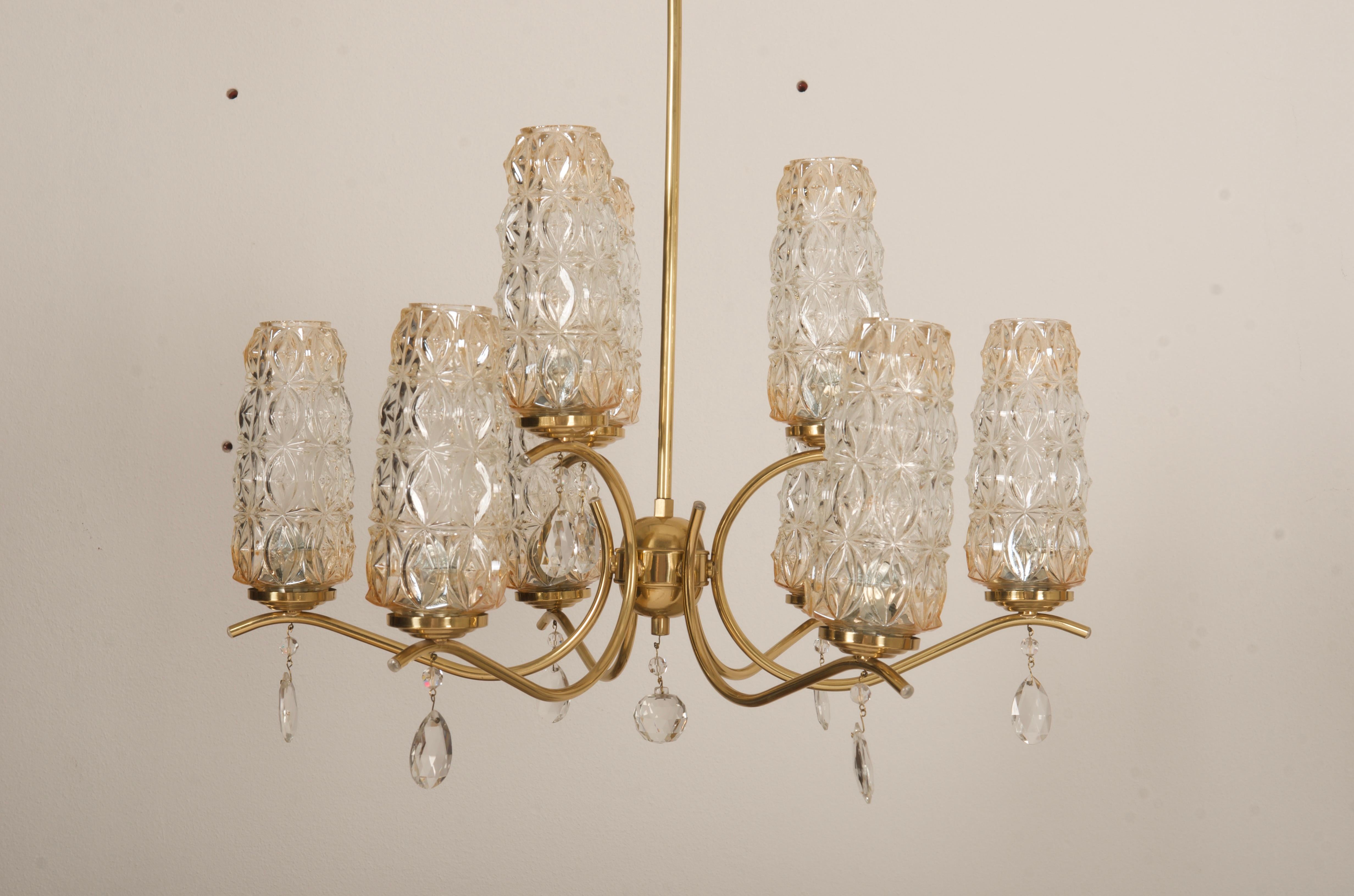 Brass construction with twelve arms and opaline glass shades each fitted with E14 sockets. Made in Austria early 1950s.
Total height can be customized.
 