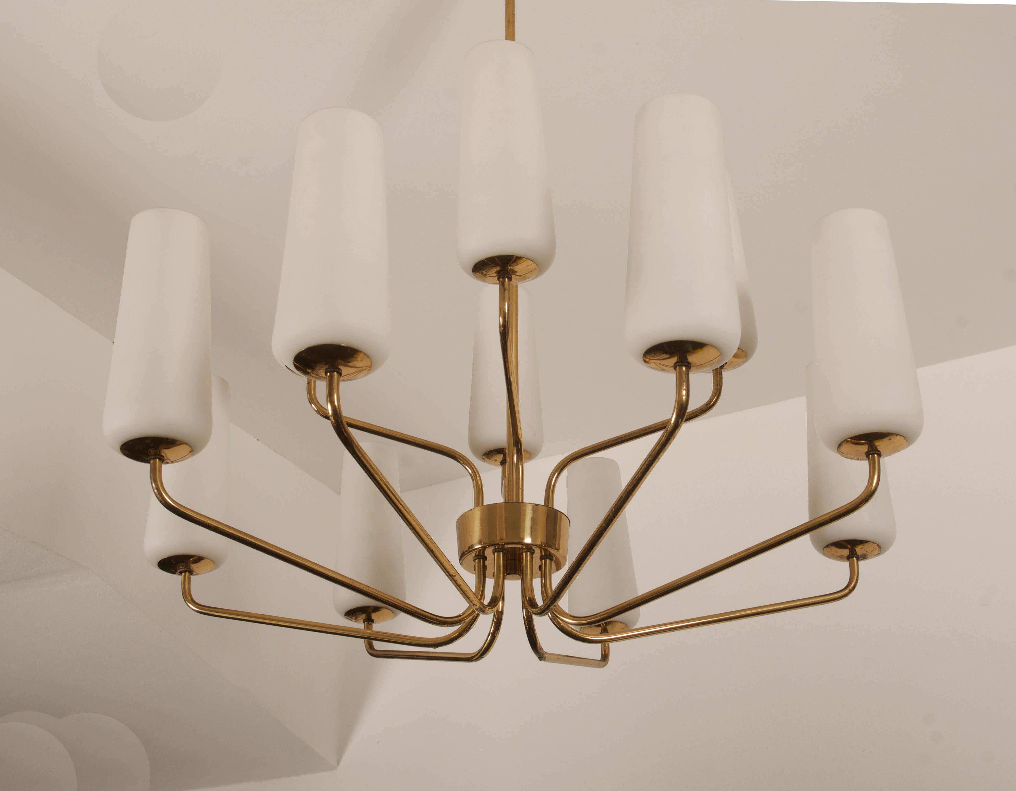 Brass construction with twelve arms and opaline glass shades each fitted with E14 sockets. Made in Vienna by Rupert Nikoll in the early 1950s.
  